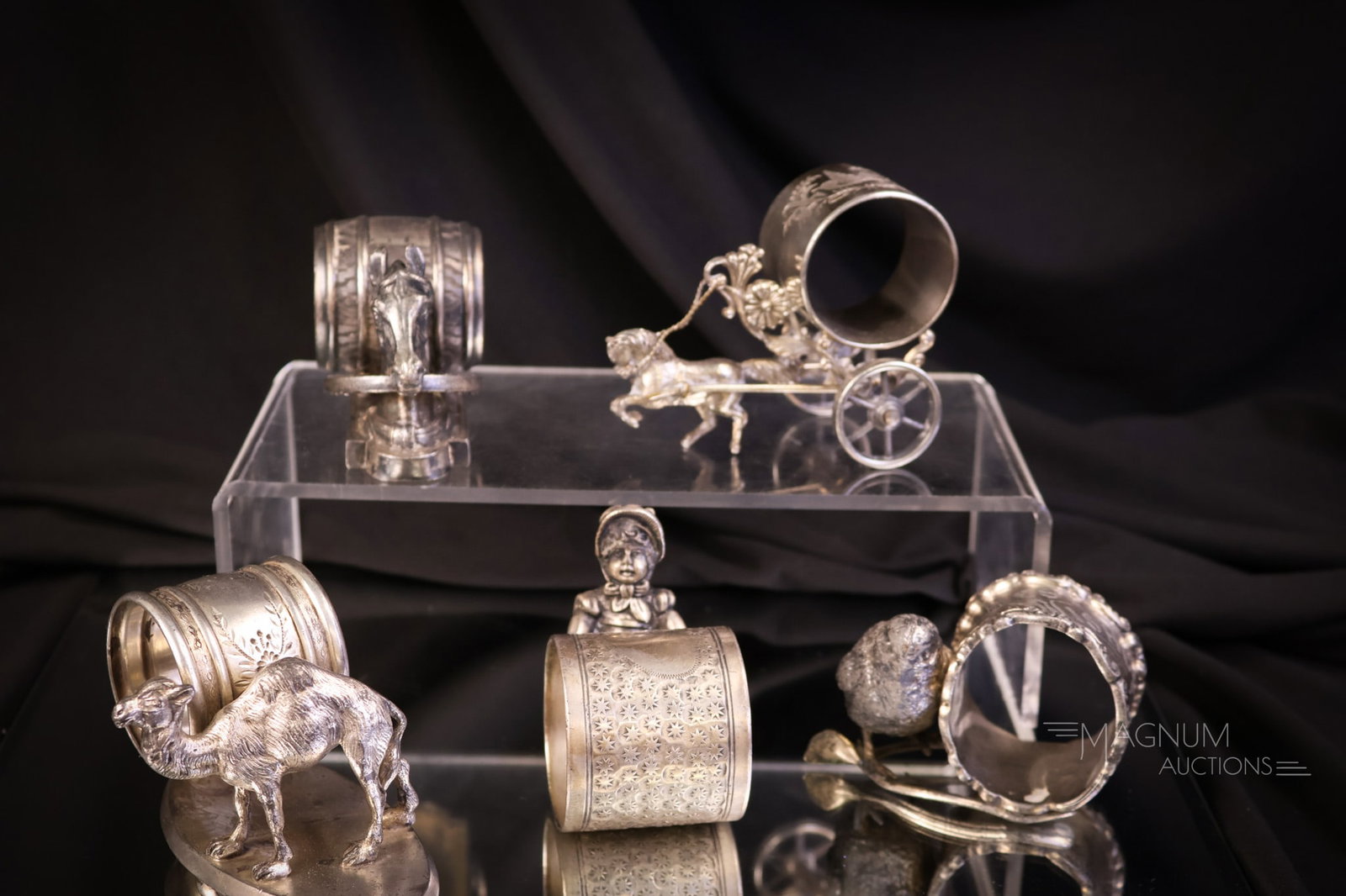 5 pc Lot Silverplate Figural Napkin Rings Meriden Kate Greenaway & More: Five unique examples of Victorian silverplate napkin rings. Various forms. Meriden is one of the noted makers. The tallest measures 2 1/2". SHIPPING NOTICE: If you choose not to utilize the LiveAuctio