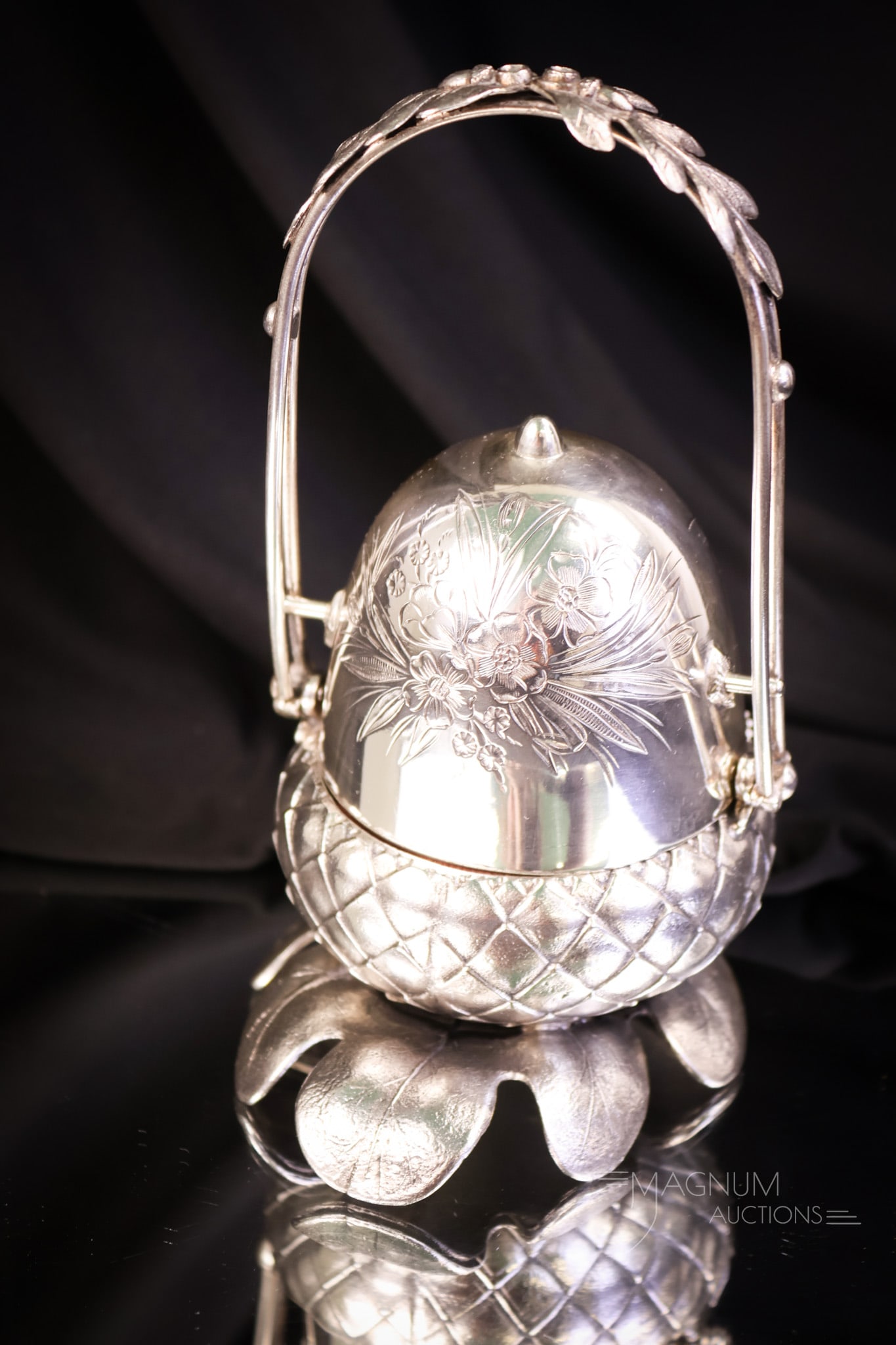 Webster Silverplate Victorian Figural Acorn Mechanical Jewelry Casket: A beautiful and scarce find in a Victorian silverplate mechanical jewelry casket. This is in the form of an acorn resting on an oak leaf. This casket features a maroon lining. The piece measures 6 3/4