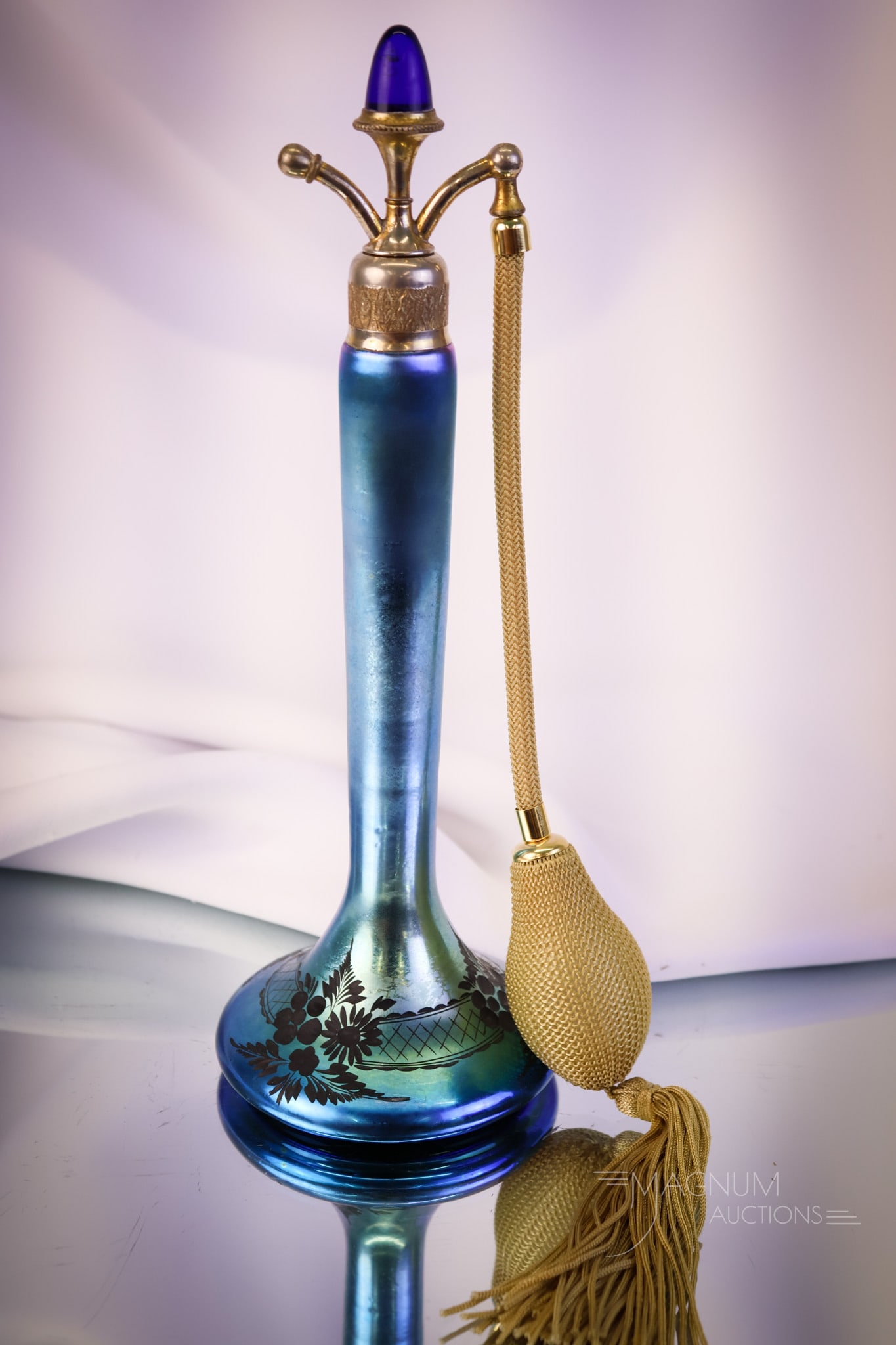 Steuben Blue Aurene Glass Jewel Top Perfume Atomizer: A beautiful and sleek Steuben blue Aurene glass perfume atomizer. This beauty measures 10" tall and 3 1/2" wide. The glass features intaglio cutting. Lovely! SHIPPING NOTICE: If you choose not to util