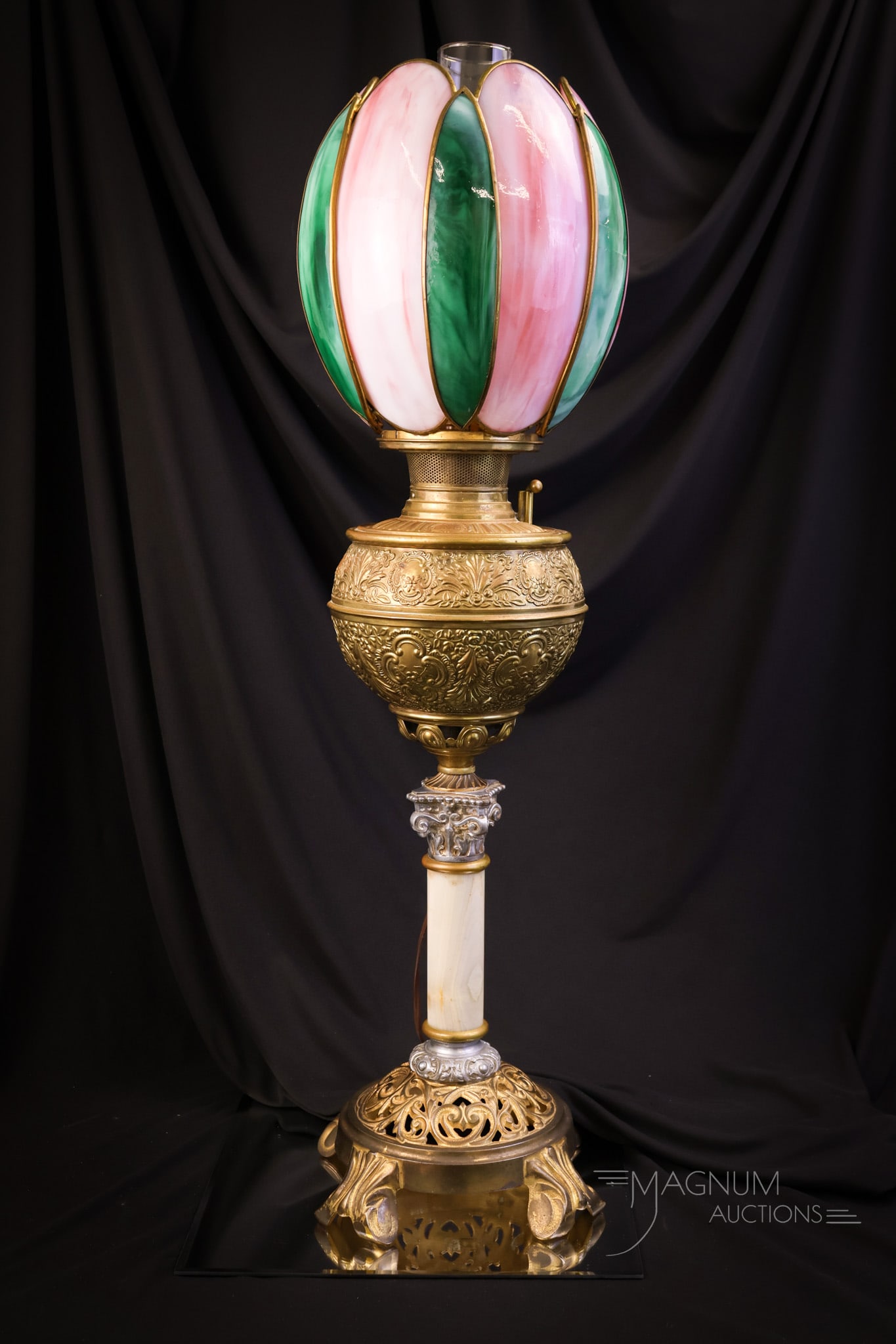 Bradley & Hubbard Victorian Leaded Tulip Shade Banquet Lamp: A rare find in a Victorian Bradley & Hubbard banquet oil lamp. This one has a beautiful green and pink leaded slag glass shade in the form of a tulip. The lamp has been electrified. The lamp measures 