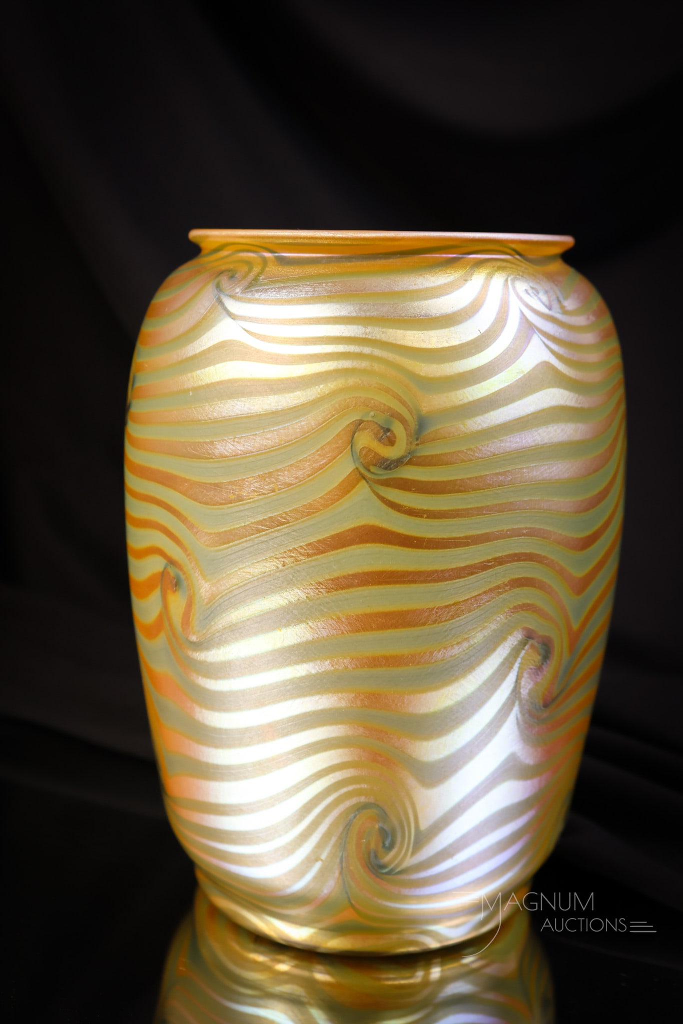 Signed Durand King Tut Iridescent Art Glass Vase: A beautiful singed example of Durand art glass. This one is in the King Tut pattern in green and orange iridescent glass. The vase measures 6" tall and 4" wide. SHIPPING NOTICE: If you choose not to u