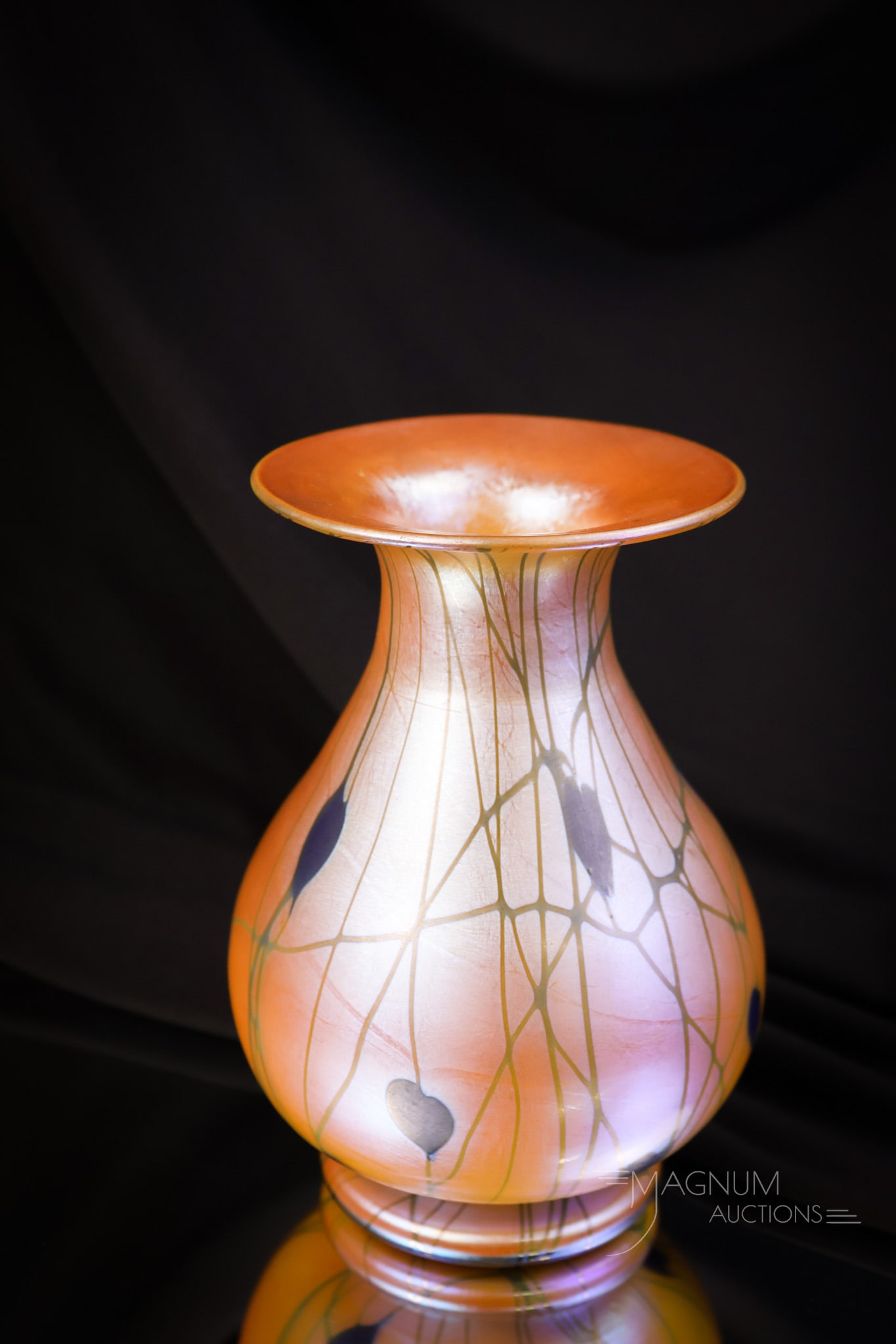 Unmarked Durand Orange& Blue Iridescent Heart & Vine Iridescent Glass Vase: A beautiful find in unmarked Durand art glass. This is an orange and blue iridescent glass vase. The vase features blue hearts on an orange ground. The vase measures 6" tall and 4" wide. SHIPPING NOTI