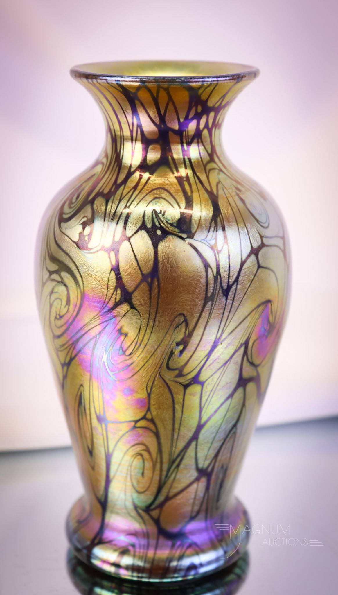 Durand Iridescent Art Glass Coil Vase: Another beauty in our lineup of Durand art glass. This piece is unsigned. It is a Coil vase with gold iridescence and amethyst coil lines. The vase measures 6" tall and 3" wide. SHIPPING NOTICE: If yo