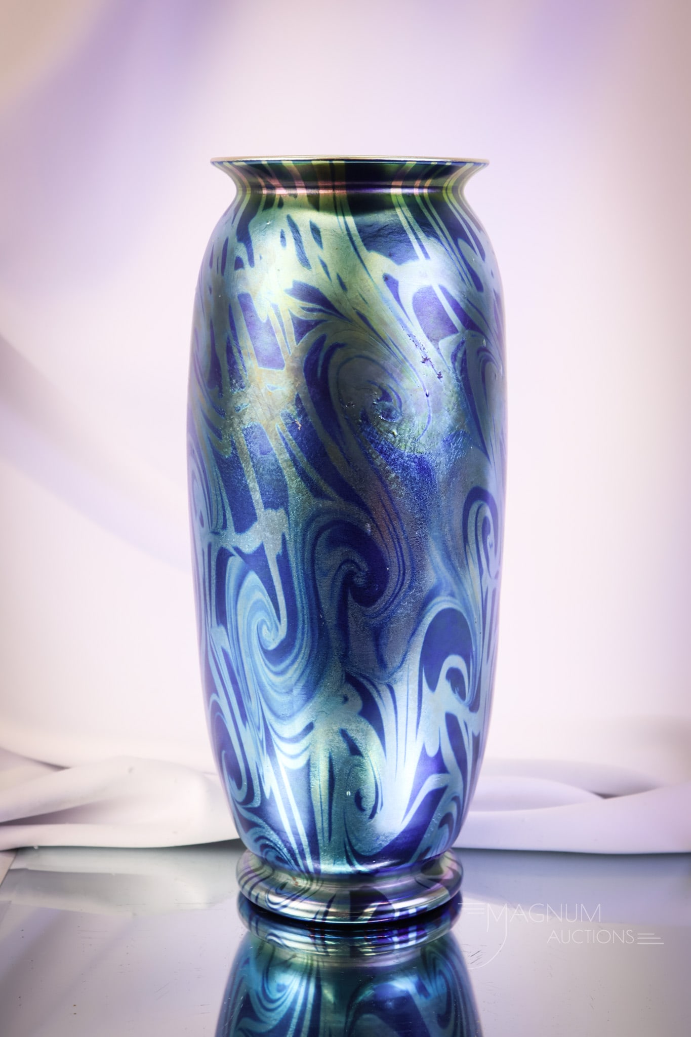 Impressive Durand Electric Blue Iridescent Coil Art Glass Vase: What an impressive piece this is! This piece is an unsigned Durand art glass vase. This Coil vase has a gold interior and an electric blue exterior with amazing iridescence. The vase measures 12 3/4"