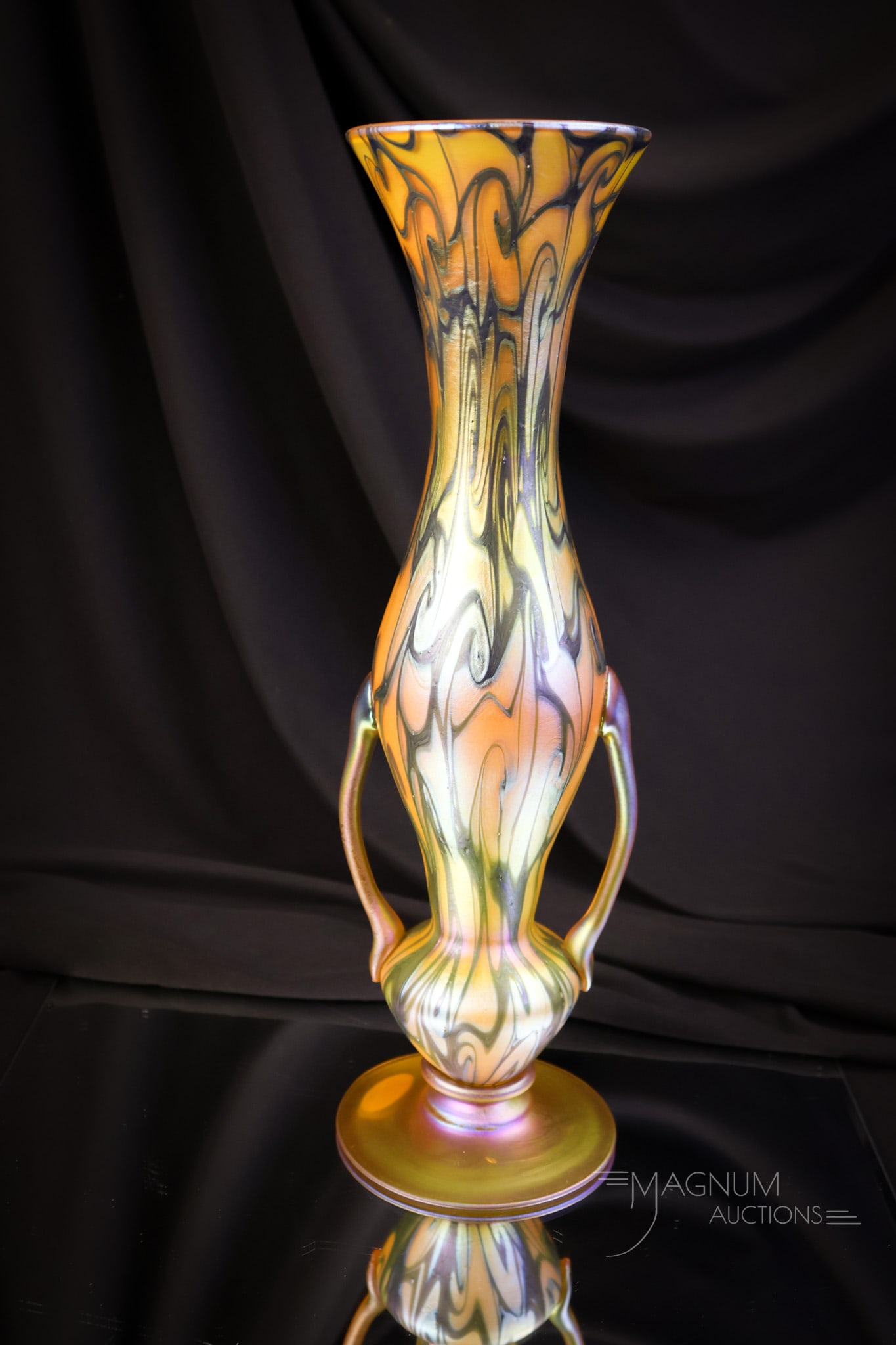 Quezal 12 1/2" Gold Iridescent Art Glass Footed Coil Vase: An amazing, unsigned Quezal Art glass vase. This piece of Quezal features double handles and is footed. The vase has a gold iridescent coil design. The vase measures 12 1/2" tall and 3 3/4" wide. SHIP