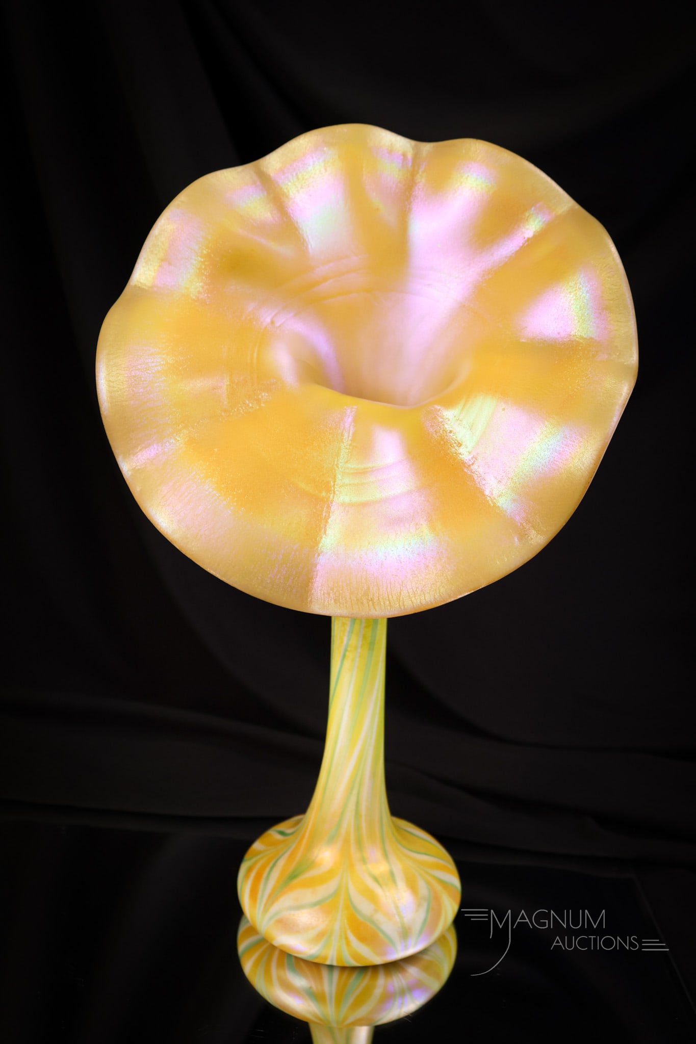 Signed 12 1/2" Quezal Pulled Feather Jack in the Pulpit Onion Skin Art Glass Vase: A fantastic find in a signed Quezal pulled feather Jack in the Pulpit art glass vase. This vase features a large mouth with a brilliant onion skin stretch effect. The feather is green and orange with 
