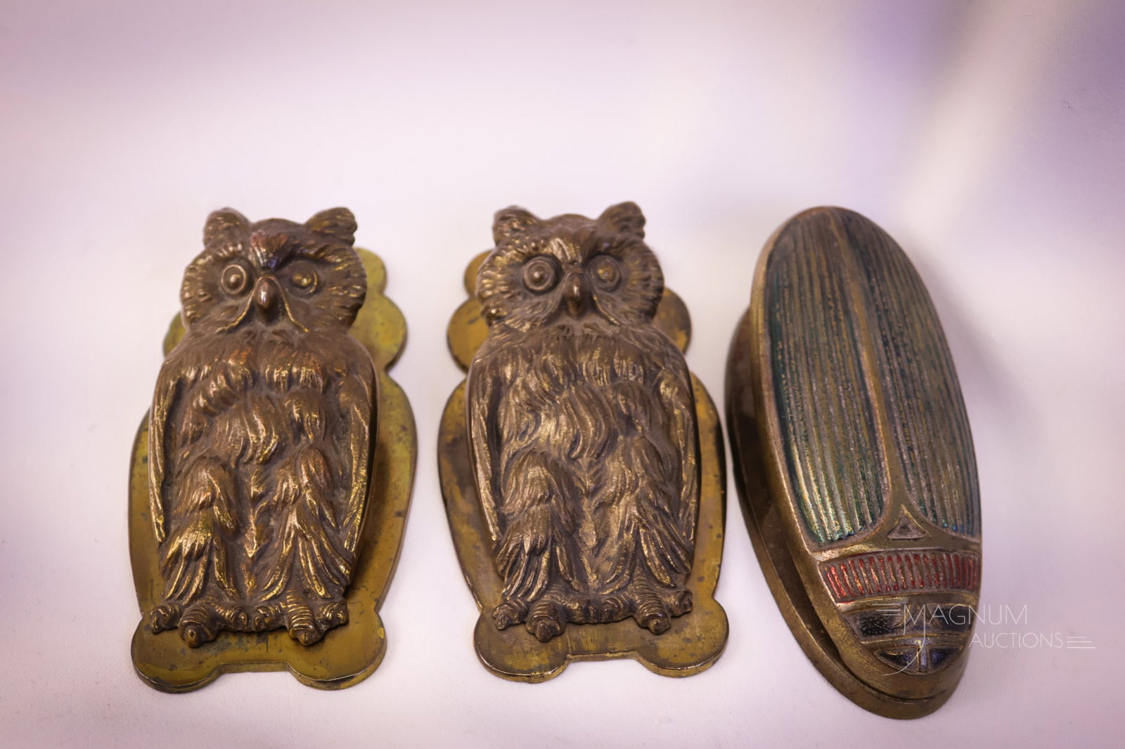 3 pc Lot Bradley & Hubbard & JuddArt Nouveau Iron Wall Clips: A select offering of three antique Art Nouveau iron wall clips. The first is a marked, "C.J.O. Jedd Mfg. scarab beetle. Two and three are Bradley & Hubbard examples in the form of owls. The tallest me