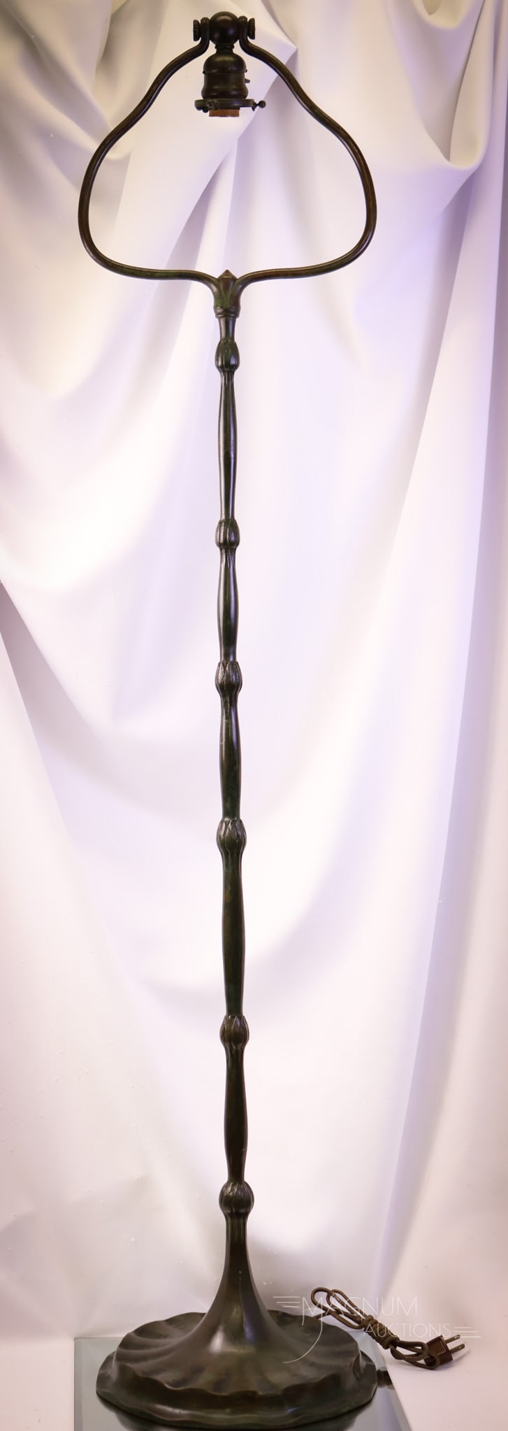 Signed "Tiffany Studios New York 670" Bronze Antique Art Nouveau Floor Lamp: A wonderful condition, estate fresh ,Tiffany Bronze Art Nouveau harp floor lamp. This lamp is signed, "Tiffany Studios New York 670." It features an Art Nouveau design of a lotus buds up the stem. Thi