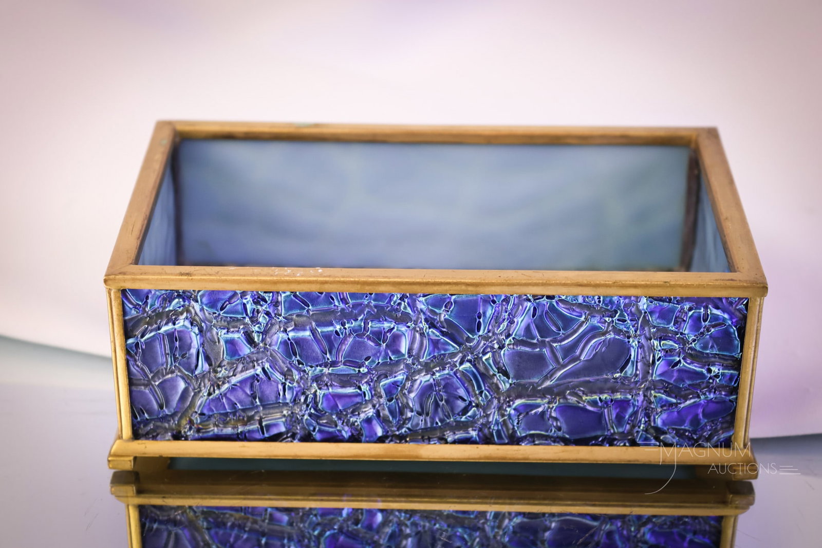 Marked "Louis C. Tiffany Furnaces Inc. 114" Gilt Bronze Blue Crackle Favrile Glass Box: A gorgeous piece of Tiffany glass and bronze. This piece is marked, "Louis C. Tiffany Furnaces Inc. 114." The box is gilt bronze with blue crackle Favrile glass inset panels. This piece has extraordin