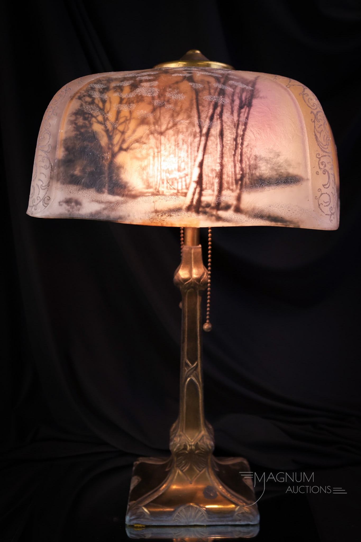 Pittsburg Reverse & Obverse Painted Antique Table Lamp: A beautiful Pittsburgh reverse, and obverse painted scenic winter scene antique table lamp. The base is marked 1712. The lamp measures 18" tall and 11 1/2". The lamp has been professionally rewired. S