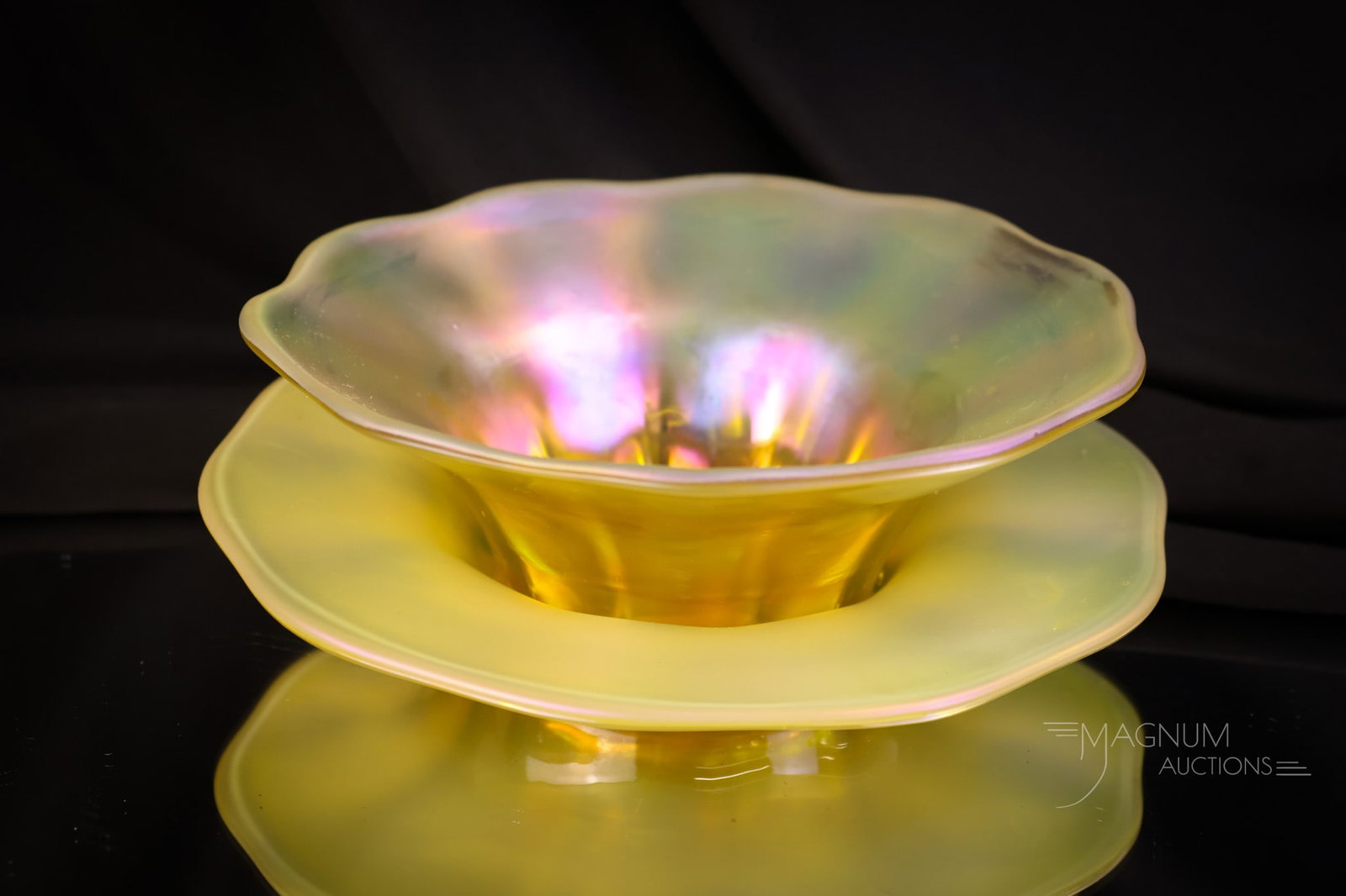 Signed "L.C.T." Gold Favrile Art Glass Finger Bowl & Underplate: A select offering of a signed, "L.C.T." gold Favrile iridescent glass finger bowl with an underplate. This fine example measures 2 1/2" tall and 7" wide. SHIPPING NOTICE: If you choose not to utilize 