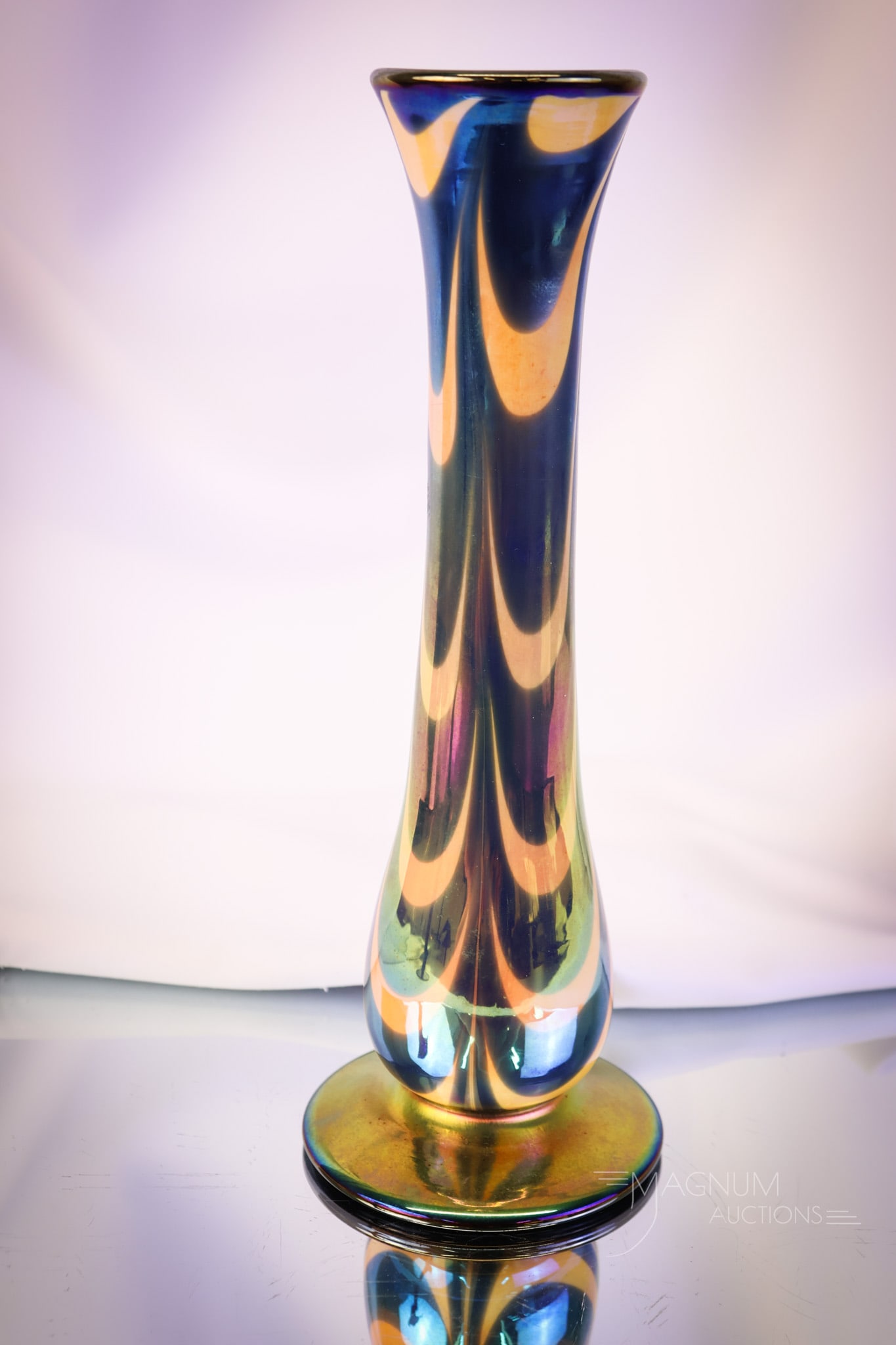 Imperial Freehand Footed Festoon Drag Loop Art Glass Vase: A very nice find in Imperial frehand art glass. This vase is a footed version with festoon decoration. The vase is in orange iridescent glass with blue drag loops. The vase features the original paper