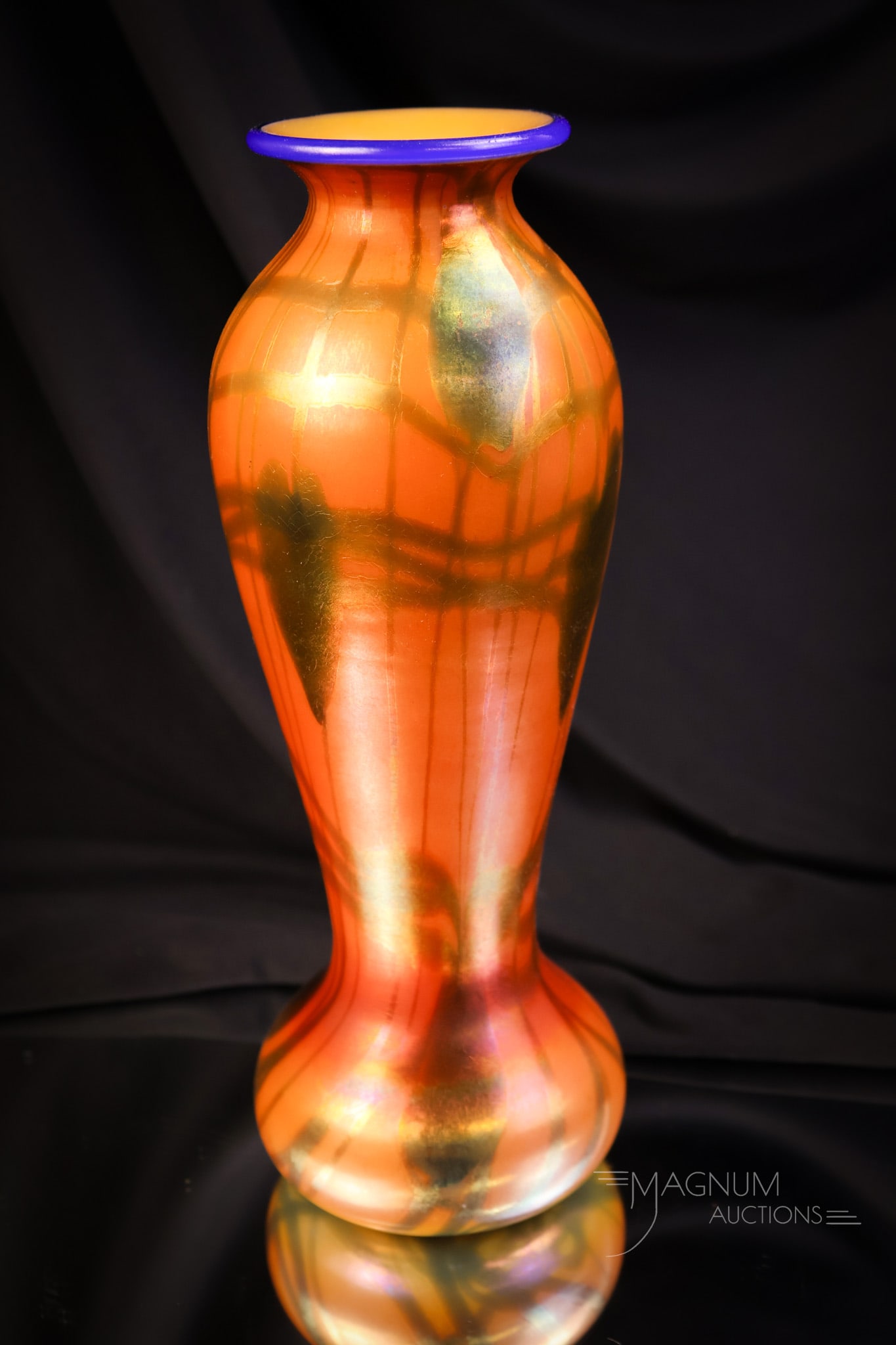 Imperial Freehand Heart & Vine Art Glass Vase: A beautiful Imperial freehand heart & vine art glass vase. The vase is in vivid orange with a blue heart & vine and a blue rim. The vase measures 10" tall and 3 1/4" wide. SHIPPING NOTICE: If you choo