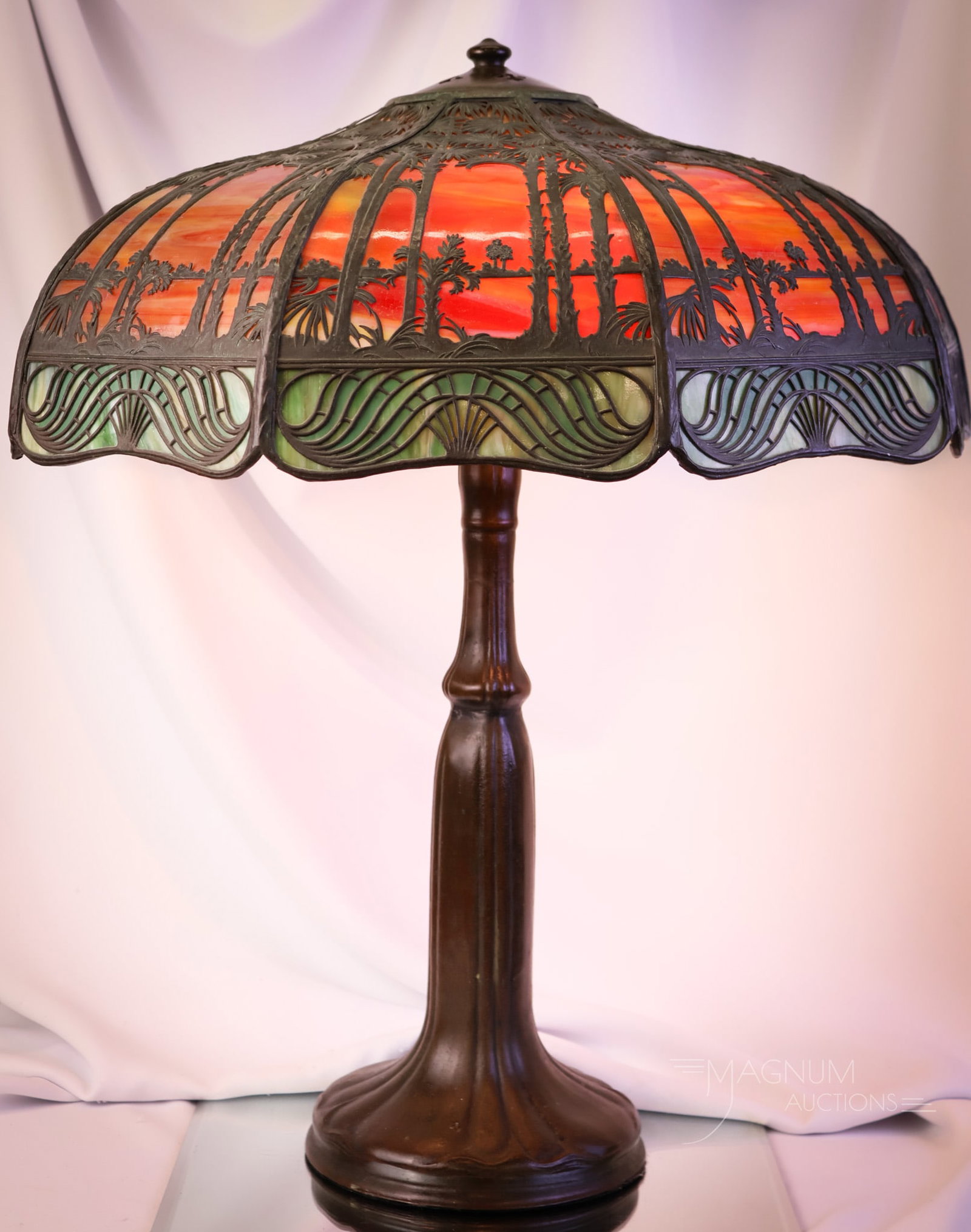 Handel Sunset Palm Slag Glass Filigree Overlay Antique Table Lamp: A beautiful find in a Handel Sunset Palm slag glass filigree overlay antique table lamp. This lamp is estate fresh and in original condition. The shade has the original tag in the leadwork. The base i