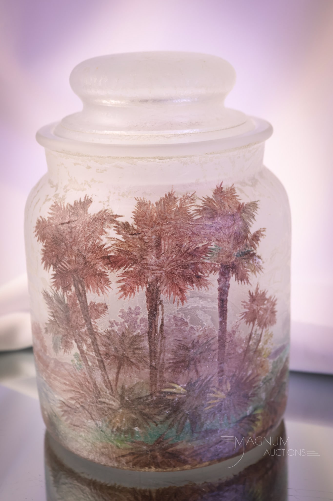 Signed "Handel 4204" Chipped Ice Teroma Glass Painted Humidor: A beautiful find in a signed, "Handel 4204" Teroma painted and chipped ice glass humidor. This piece is decorated with palm trees, a beach, and a sailboat. The humidor measures 8 1/2" tall and 5 3/4" 