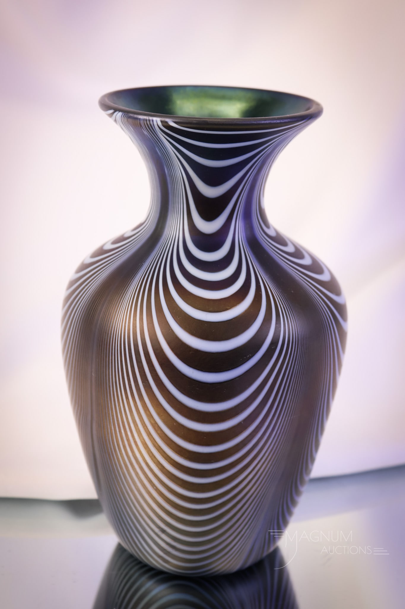 Imperial Freehand Lead Lustre Cobalt Iridescent Drapery Vase: A beautiful find in Imperial freehand lead lustre glass. This vase is in coblat iridescent glass with a drapery pattern. The vase has a blue interior. The vase measures 8" tall and 4 1/4" wide. SHIPPI