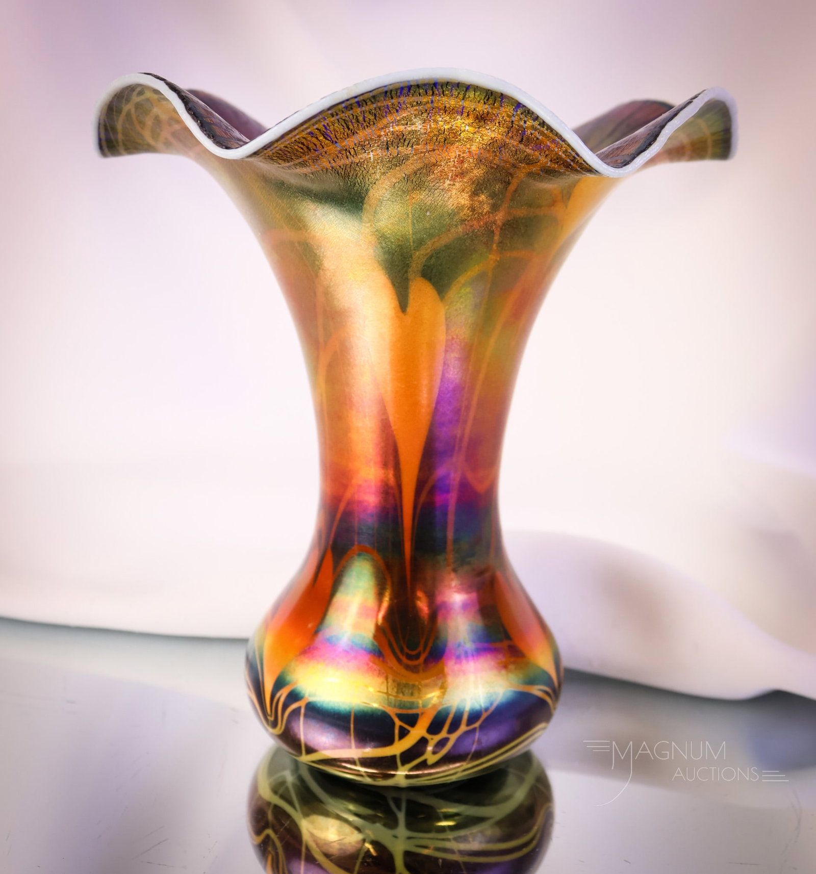 Imperial Freehand Heart & Vine Blue & Orange Iridescent Art Glass Vase: What a lovely find this art glass piece of Imperial is! This Imperial freehand vase is in blue iridescent with orange heart and vine decoration and a white rim. The vase has an onion skin stretch effe