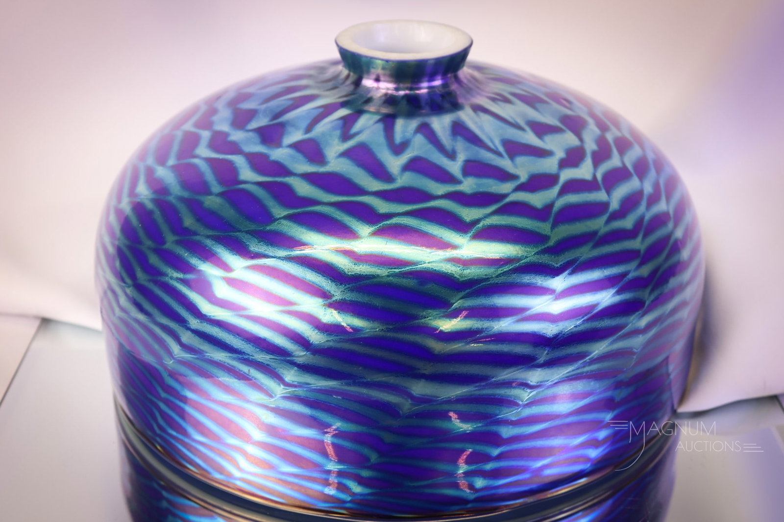 Iridescent Studio Art Glass Snakeskin Glass Lamp Shade: A beautiful iridescent studio art glass shade. This gorgeous piece is in electric blue iridescent glass with a snakeskin or fishscale pattern to it. The shade has a white interior. The shade measures 