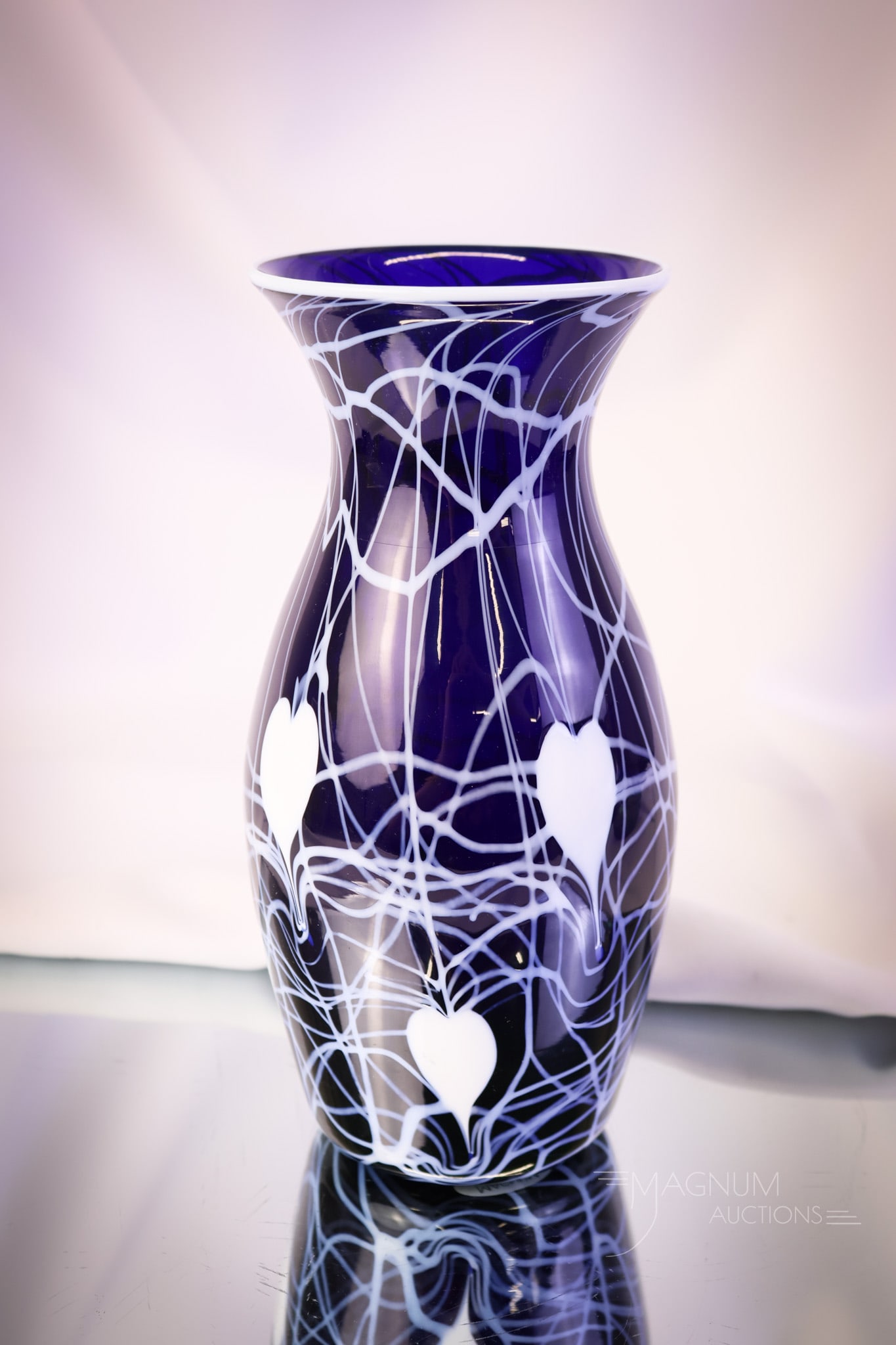 Imperial Freehand Heart & Vine Art Glass 8" Vase: A great piece of Imperial freehand art glass. This vase measures 8" tall and 4" wide. It is in cobalt with white heart & vine decoration and a white rim. SHIPPING NOTICE: If you choose not to utilize 