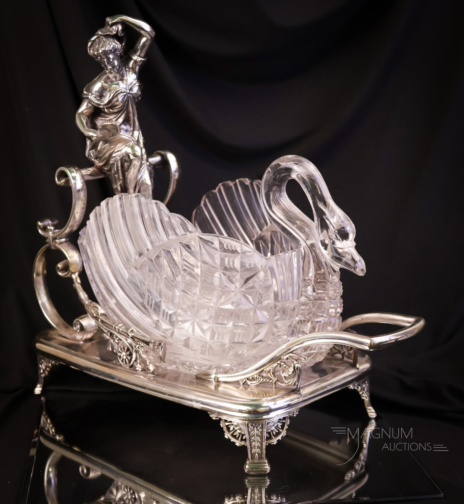 Rare Meriden Victorian Silverplate Figural Lady w/ Mirror Crystal Swan Centerpiece: What a find this piece is! This is a Mother Magnum favorite. The piece is marked Meriden silverplate. The large holder measures 14" tall and 14 1/2" wide. It features a figure of a lady holding a hand