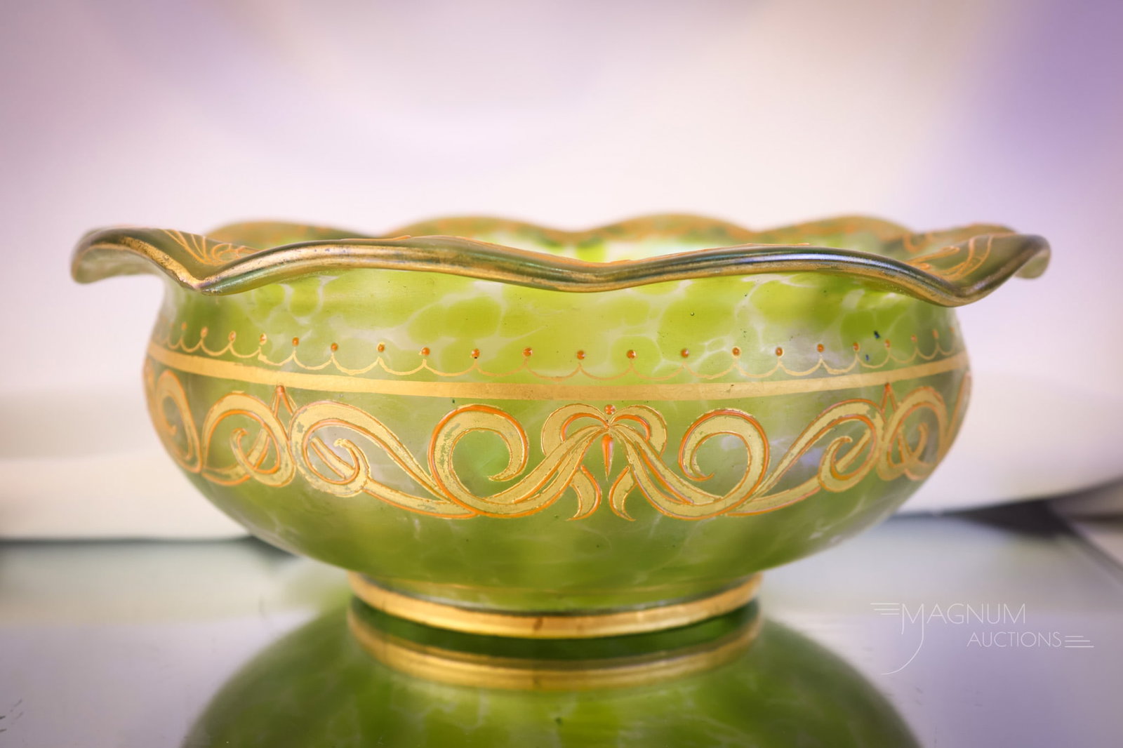 Loetz Green Oil Spot Iridescent Enamel & Gilt Glass Bowl: A beautiful and seldom-seen piece of Loetz in green oil-spot glass. This piece is enamel and gilt decorated. The bowl measures 3 3/4" tall and 9 1/4" wide. SHIPPING NOTICE: If you choose not to utiliz