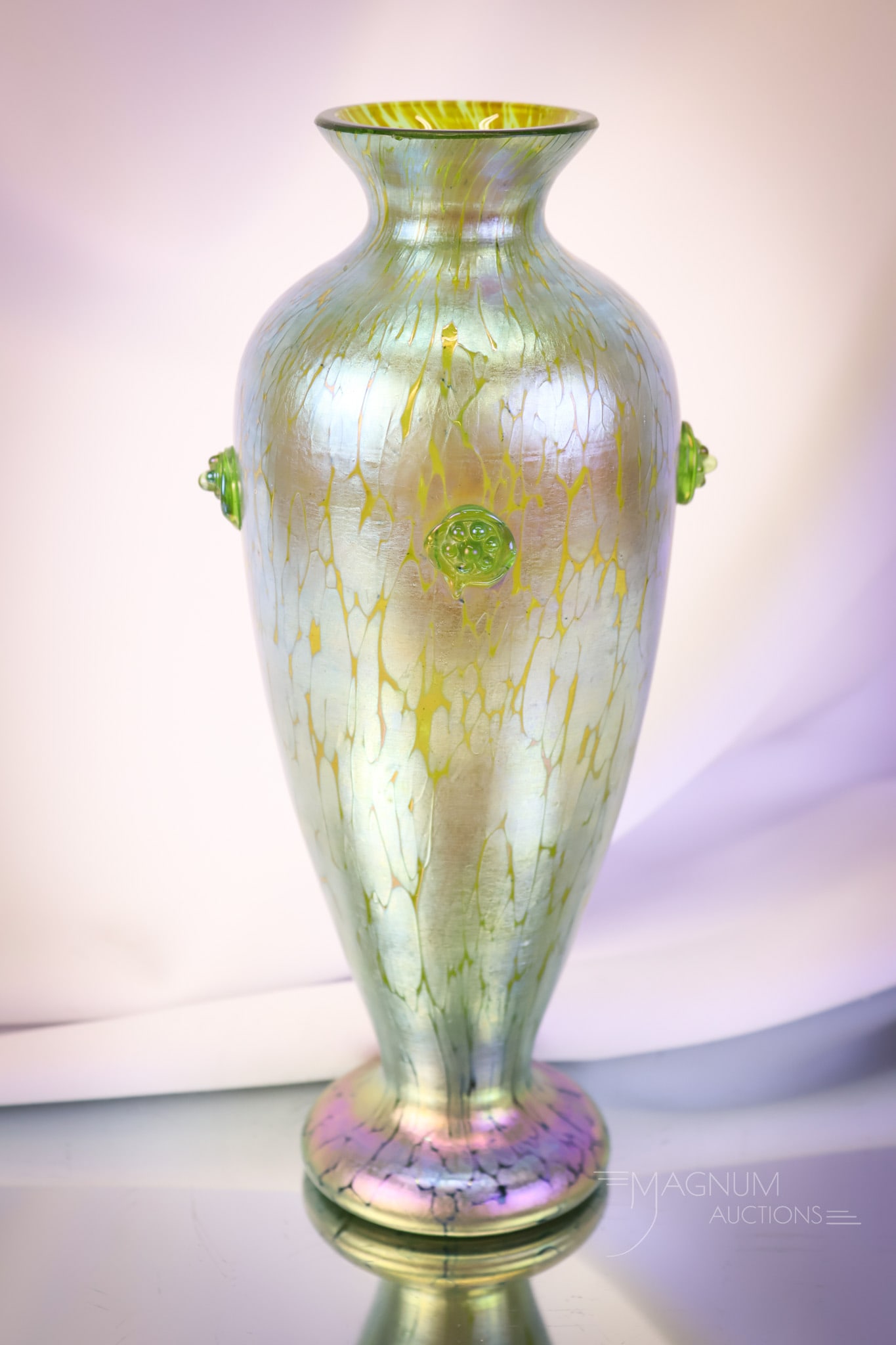 Loetz Crete Papillon Iridescent Applied Prunt Art Glass Vase: A beautiful find in a piece of Loetz Crete Papillon. This iridescent glass vase features four applied raspberry glass prunts on the body. The vase measures 9 3/4" tall and 3 1/2" wide. SHIPPING NOTICE
