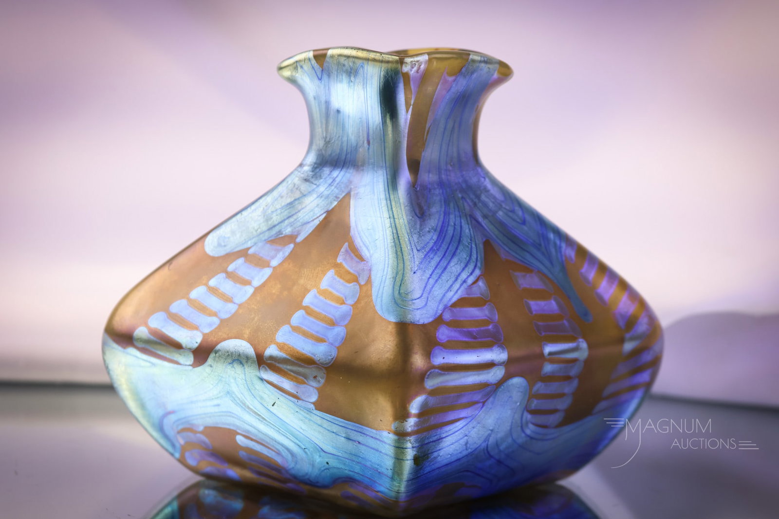 Signed Loetz Austria PG 1/158 Kirschner Form Iridescent Art Glass Vase Circa 1901: A signed Loetz Austria Kirschner form art glass vase. The vase is the Kirschner form. It is circa 1901. The vase is a PG 1/158vse. It features a bronze ground with a metallic blue iridescence. The vas