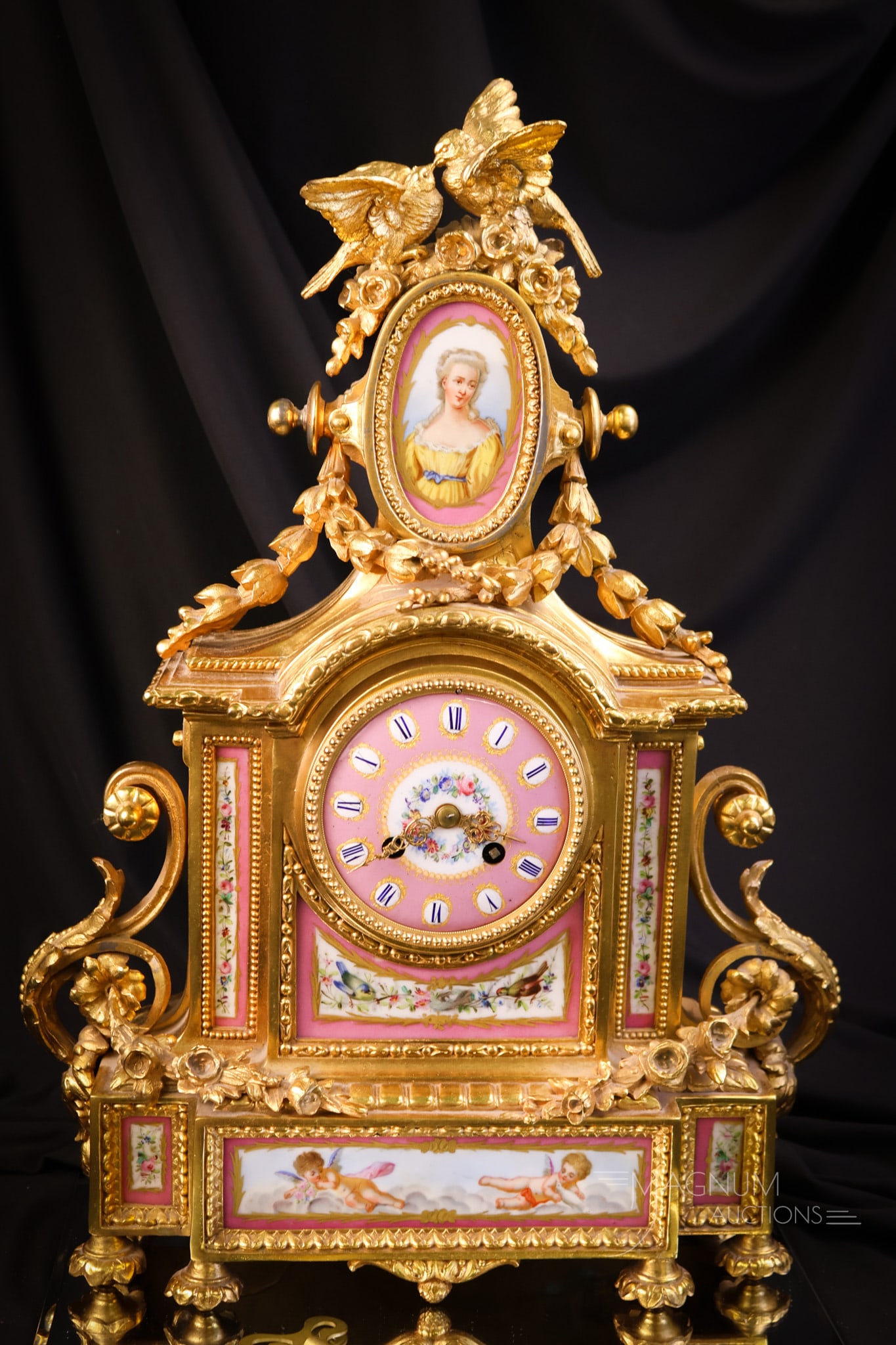 19th Century French Gilt Bronze Porcelain Plaque Mantle Clock: A phenomenal French 19th-century gilt bronze mantle clock. This great example features hand-painted Sevres-style porcelain panels decorated with florals, cherubs, birds, and a portrait. The clock is a