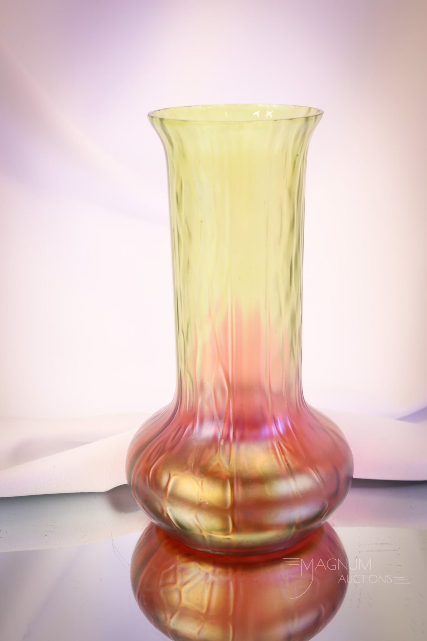 Kralik 2-Color Iridescent Art Glass 8 1/2" Vase: A beautiful piece of Kralik art glass. This one features a two-color combination in the glass from red to green. Nice iridescent finish and pattern to the glass. The vase measures 8 1/2" tall and 4 1/