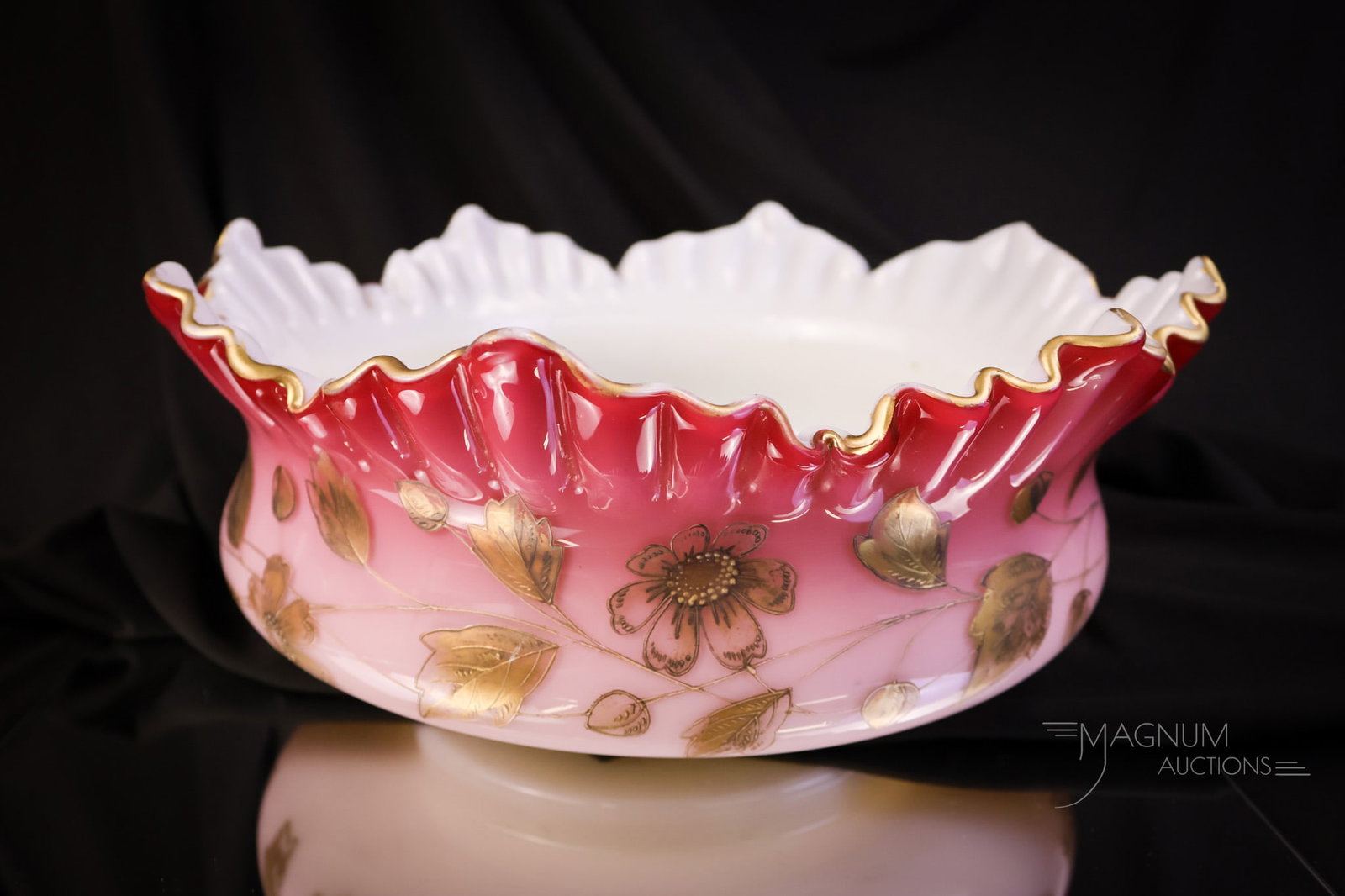 Victorian Peachblow Uranium Art Glass Gilt Decorated Victorian Brides Bowl: A wonderful find in a Victorian uranium-rich peachblow glass brides' bowl. This piece is large, measuring 10 1/2" in diameter. It stands 4 1/2" tall and has a gilt decoration of flowers around the bod