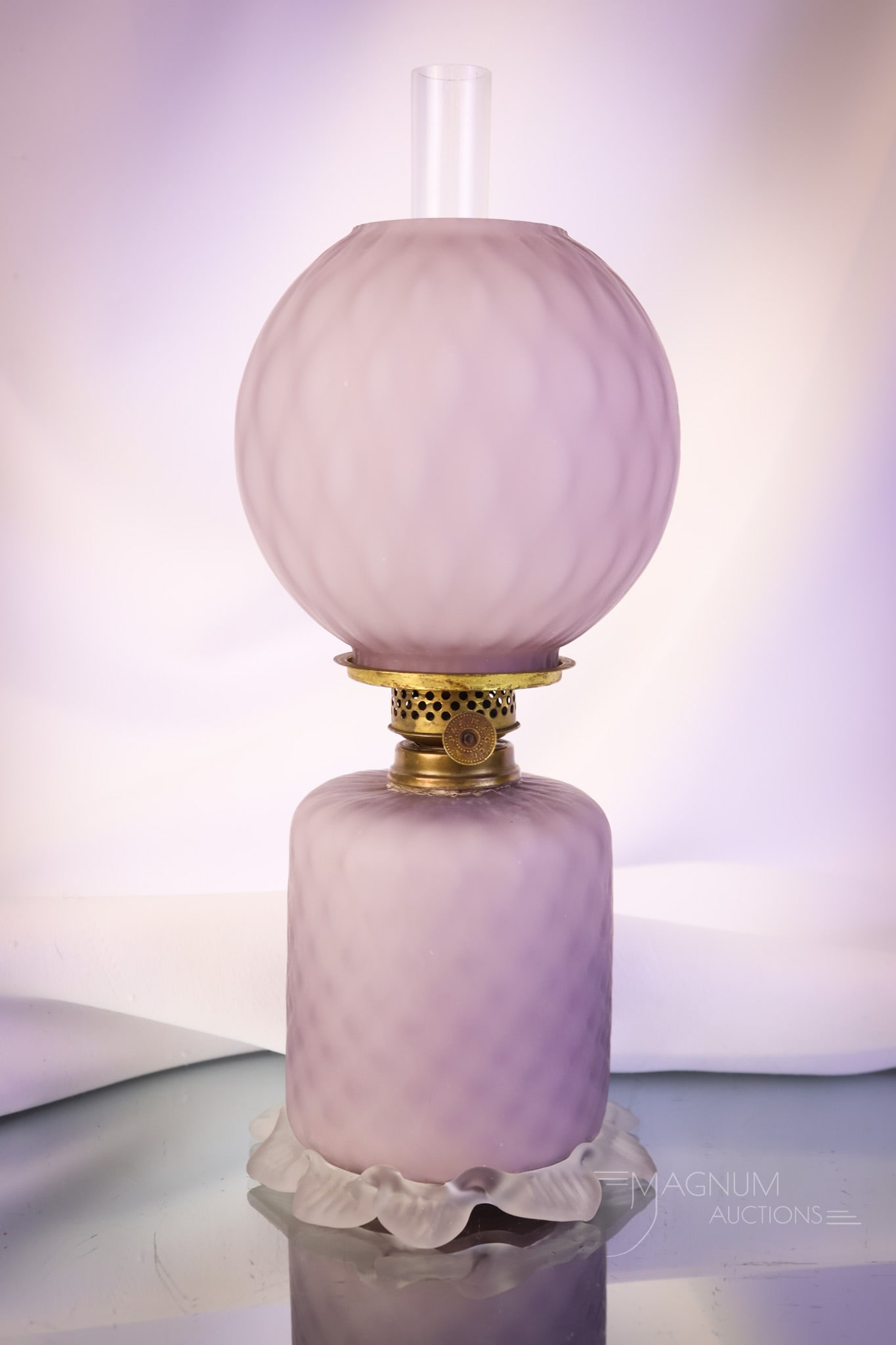Purple Lavender Diamond Quilt Cut Velvet Art Glass Miniature Oil Lamp: What a pretty find this is! This miniature oil lamp is in a purple-lavender color. The glass has a diamond quilt pattern to the glass and clear satin glass feet. The lamp measures 9" tall and 4" wide.