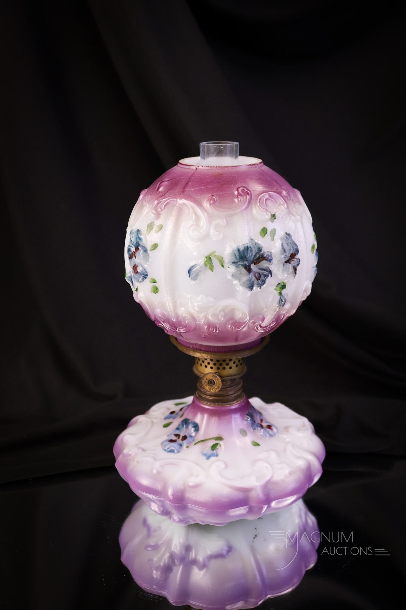Victorian Enamel Decorated Opal Glass Miniature Oil Lamp: A charming little enamel-decorated opal glass miniature oil lamp. This lamp is decorated with pansy flowers and additional decoration. The lamp measures 8" tall and 5" wide. SHIPPING NOTICE: If you ch