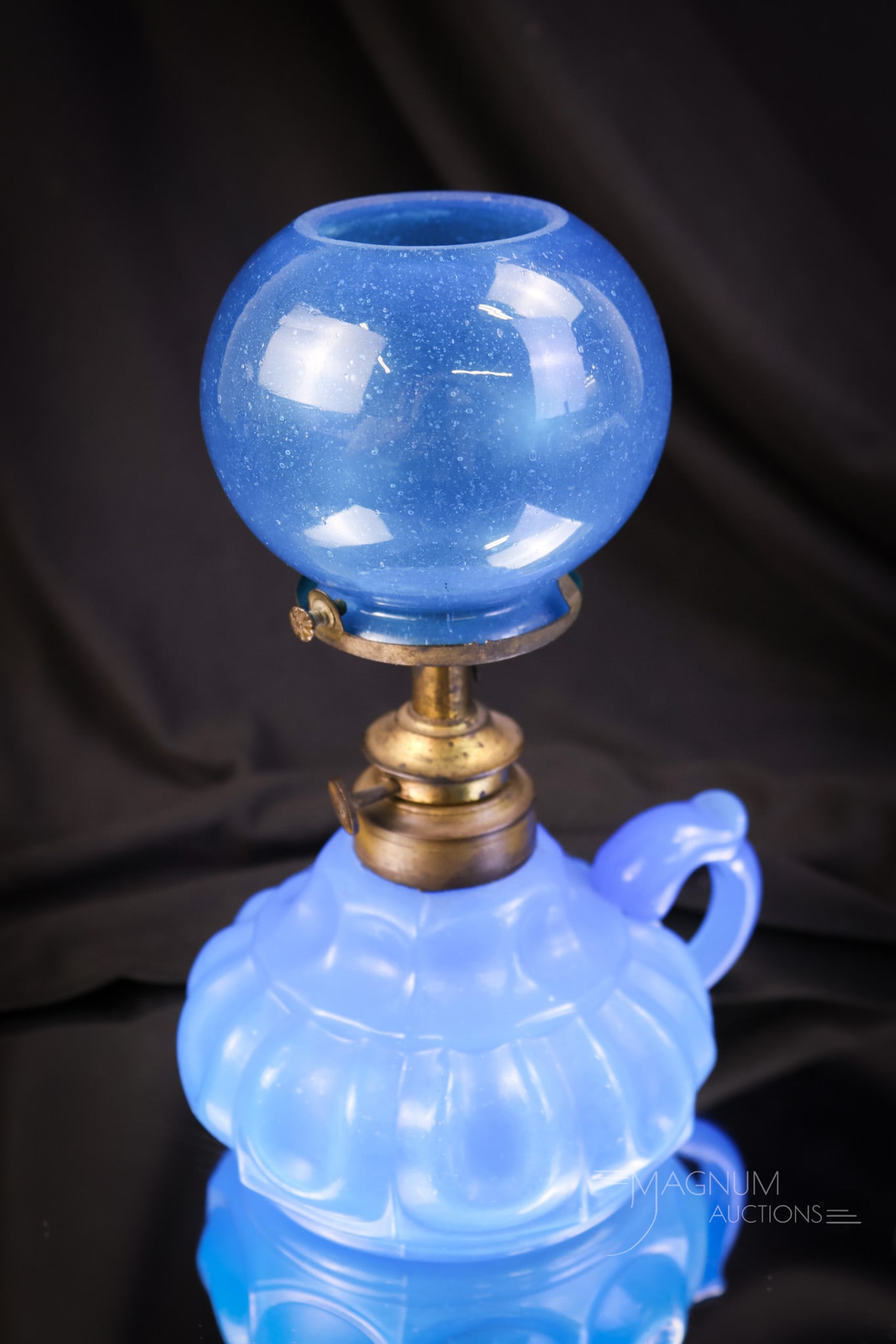Blue Opaline Clambroth Victorian Finger Miniature Oil Lamp: A blue opaline clambroth glass miniature finger oil lamp. This lamp is in a beautiful blue color. The lamp measures 7 1/2" tall and 5" wide. SHIPPING NOTICE: If you choose not to utilize the LiveAucti