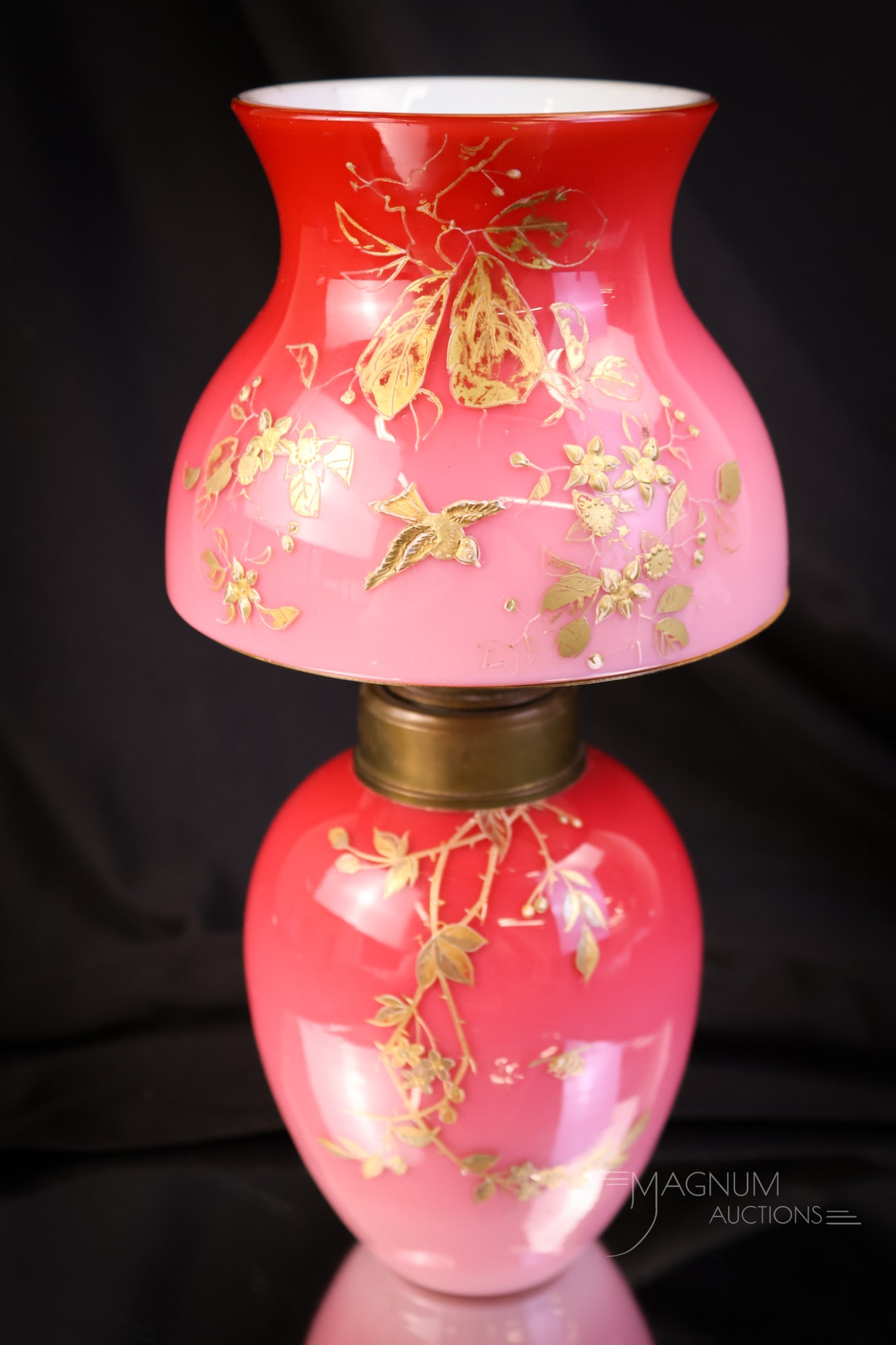 Peachblow Gilt Decorated Victorian Uranium Miniature Oil Lamp: A beautiful find in a Victorian miniature oil lamp. This one is in uranium-rich peachblow gilt decorated glass. This little lamp has a built-up floral decoration along with birds and a bee. The lamp m