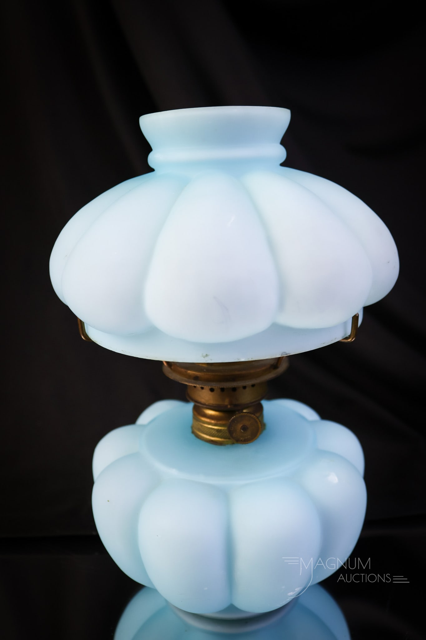 Fostoria Consolidated Victorian Blue Satin Miniature Oil Lamp: A very nice Fostoria Consolidated Bulging Loops pattern blue satin miniature Victorian oil lamp. This lamp has great color and a rich satin finish. The lamp measures 7 1/2" tall and 5" wide. SHIPPING 