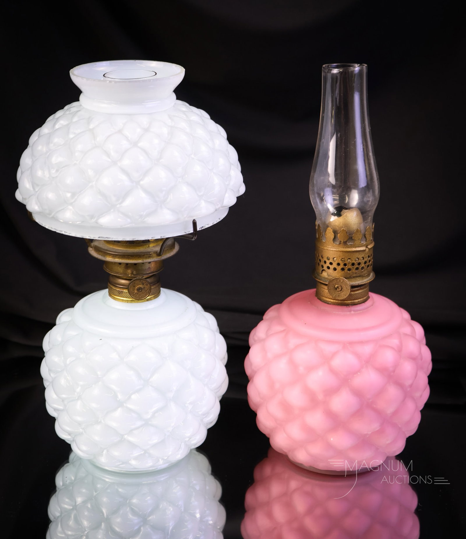 2 pc Lot Fostoria Consolidated Glass Victorian Miniature Oil Lamps: Two pieces for your collecting drama. This lot offers a blue cased Cone pattern complete miniature oil lamp, along with a pink satin glass lamp base in the same pattern. The tallest measures 8 1/4". S