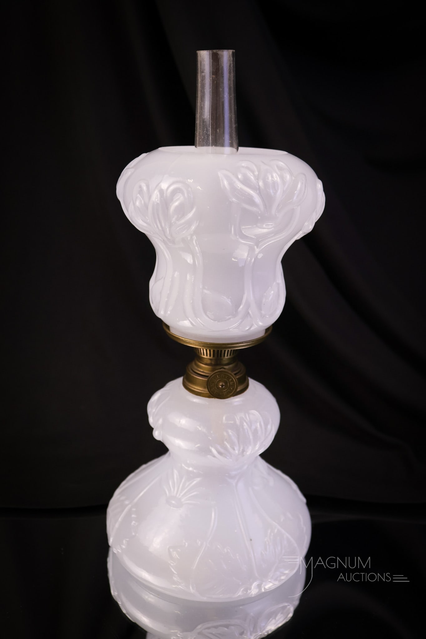 Scarce Victorian Opalescent Glass Miniature Oil Lamp: A scarce find in a Victorian miniature oil lamp. This one is in an opalescent type of glass. This lamp features an embossed leaf and flower design. The lamp measures 8" tall and 4 1/4" wide. SHIPPING 