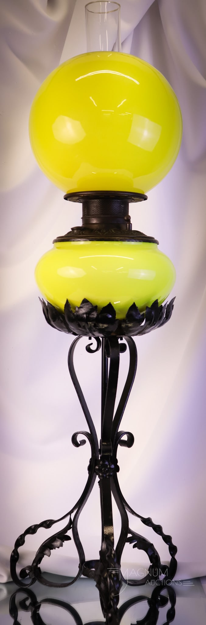 Fostoria Consolidated Yellow Cased Victorian Banquet Oil Lamp: A super find in a Victorian banquet lamp. This one is a Fostoria Consolidated example. The lamp measures 30" tall and 8" wide. The lamp has a yellow cased glass font and shade. The base is a twisted w