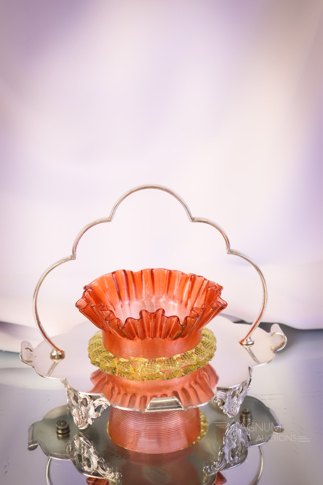 English Hallmarked Silverplate Orange Vaseline Uranium Art Glass Sweetmeat: A collection-enhancing find. This is an English hallmarked silverplate sweetmeat complete with an orange and vaseline art glass insert. The holder measures 6" tall and 7 1/2" wide. SHIPPING NOTICE: If