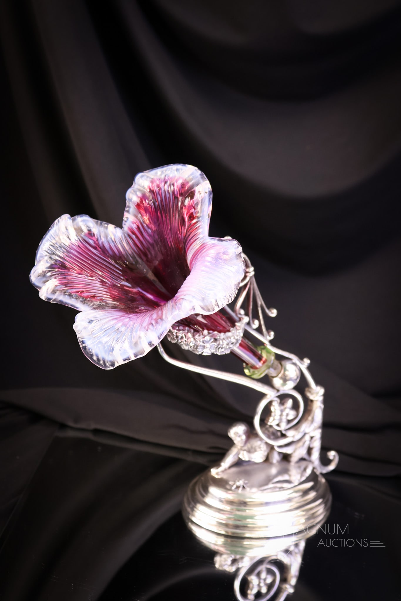 Meriden Figural Silverplate Victorian Cranberry Vaeline Art Glass Epergne Vase: A beautiful, signed Meriden figural Victorian silverplate holder with a cranberry floriform vase. The vase has a vaseline glass wafer at the base. The holder features a crawling little boy and a bee. 