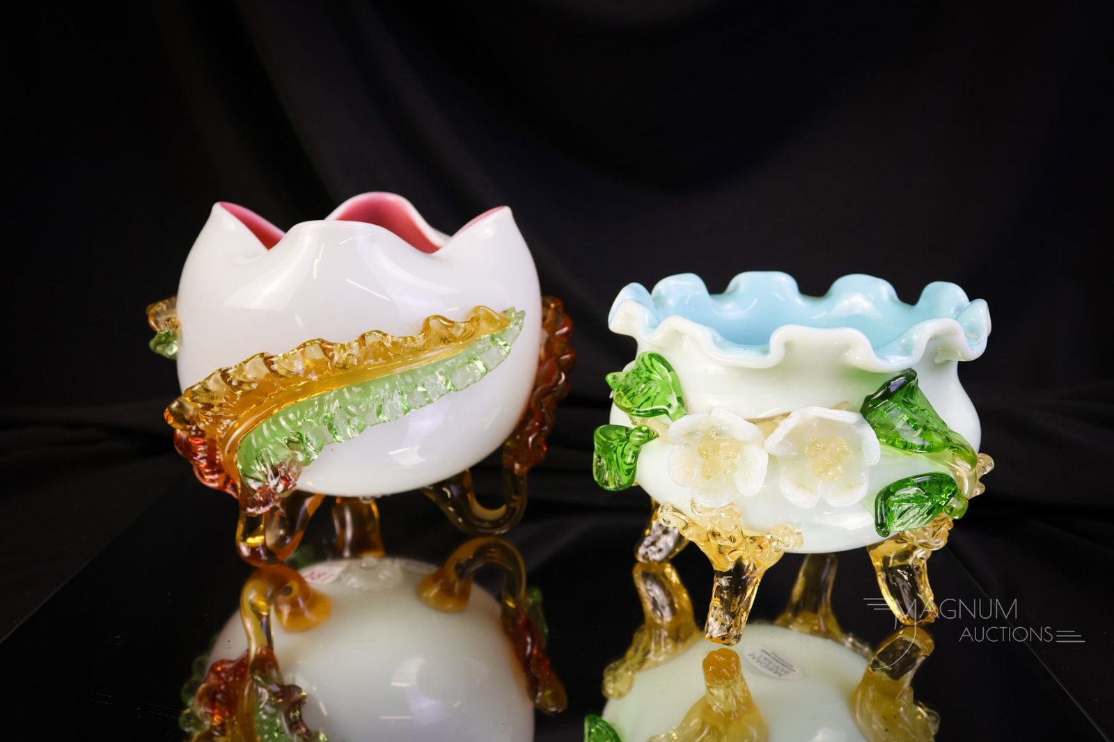 2 pc Lot Victorian Applied Art Glass Uranium Rich Rose Bowls: Two selections in rose bowls that are a pleasure. The first is a pink with a green interior and green and amber acanthus leaves. The second has a blue interior with green leaves and white flowers. Bot