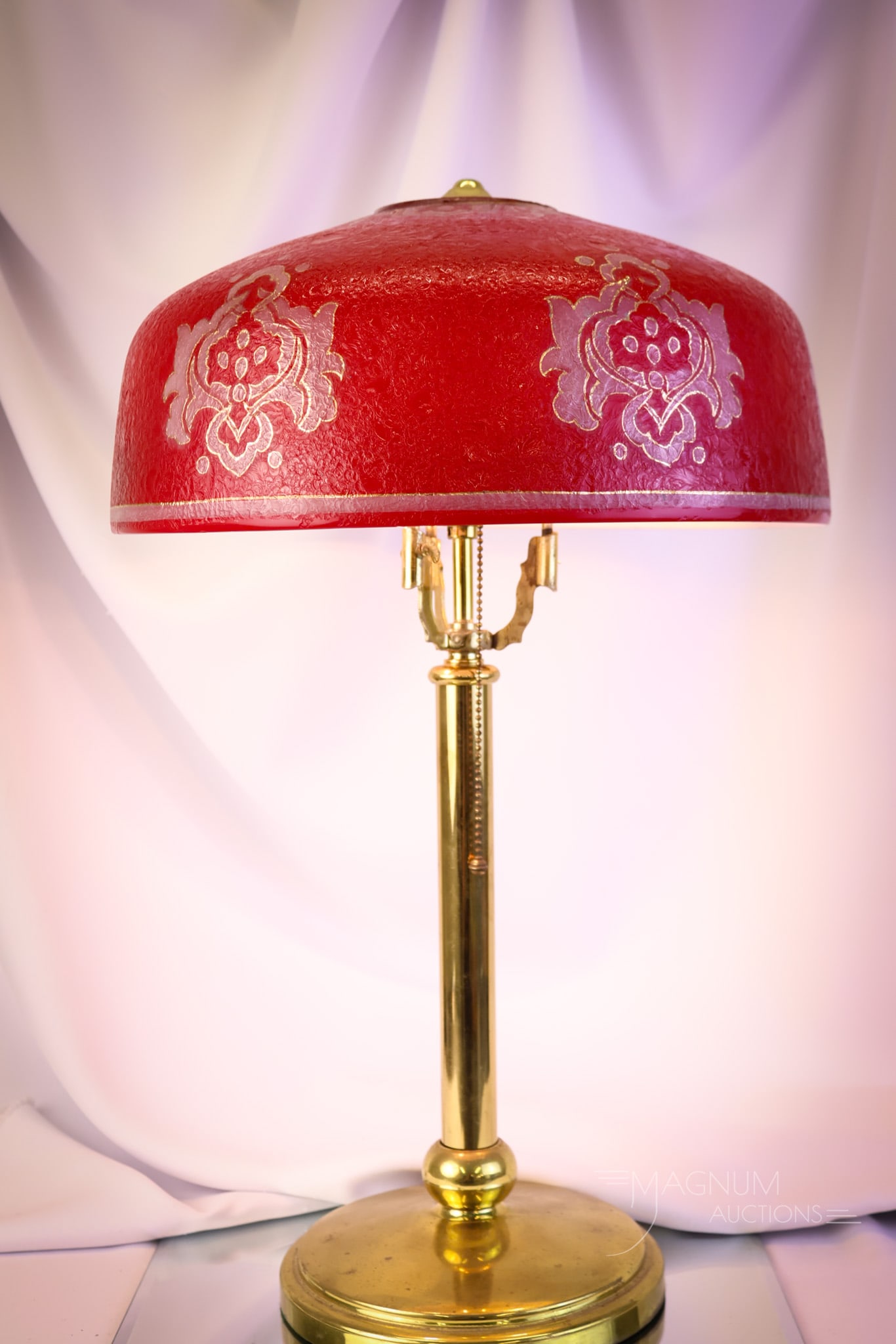Rare Pittsburgh Red Cased Chipped Ice Gilt Antique Table Lamp: A rare find in a Pittsburgh antique table lamp. This one features a rarely found red cased glass shade with gilt decoration. It resides on a polished brass base with a Bryant socket. The lamp measures