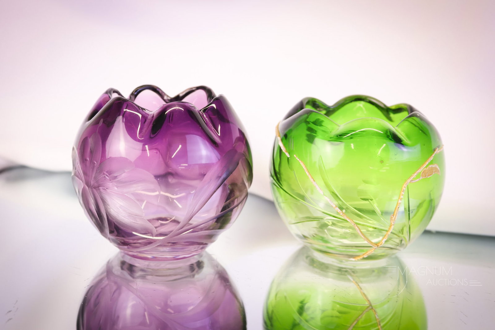 2 pc Signed Moser Karlsbas Art Glass Enamel Engraved & Intaglio Glass Rose Bowls: Two delights in signed Moser Karlsbad art glass rose bowls. The first is an amethyst with intaglio cutting of a lily. The second is a green to clear engraved with built-up decoration of enameled vines