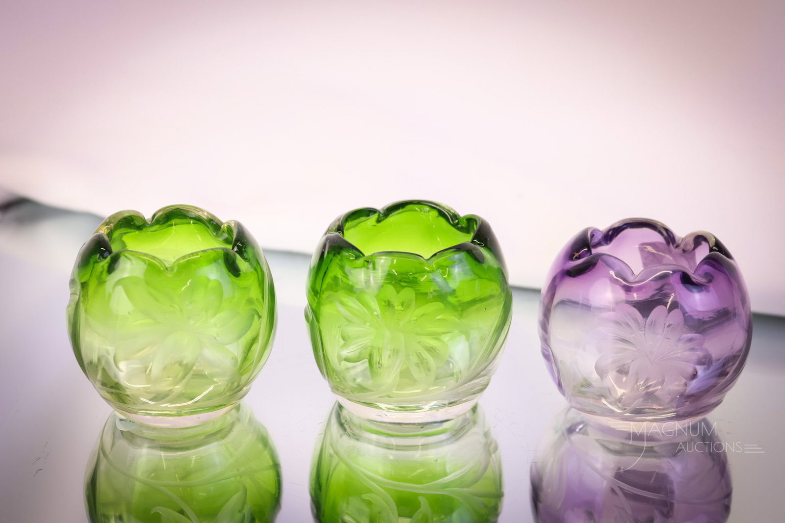 3 pc Lot Miniature Moser Glass Cut Rose Bowls Intaglio Lilies & More: Three nice finds in Moser art glass rose bowls. Two are in green cut and one is a purple to clear with intaglio cut lily flowers. The tallest measures 2". SHIPPING NOTICE: If you choose not to utilize