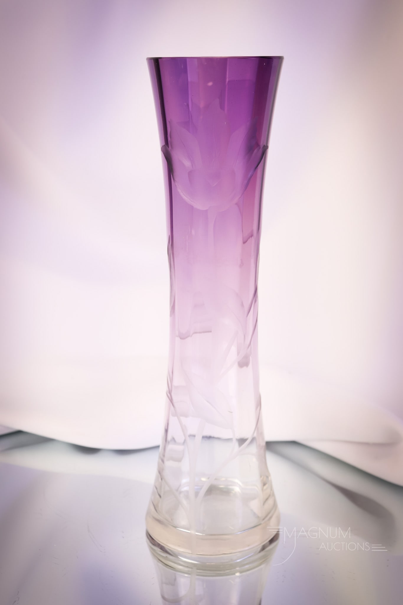 Moser Intaglio Purple to Clear Art Glass Cut Flower 11 1/2" Vase: An attractive find in a Moser intaglio cut 11 1/2" tall flower vase. This vase is purple to clear and cut with a flower and foliage. The vase is 3" wide. SHIPPING NOTICE: If you choose not to utilize 