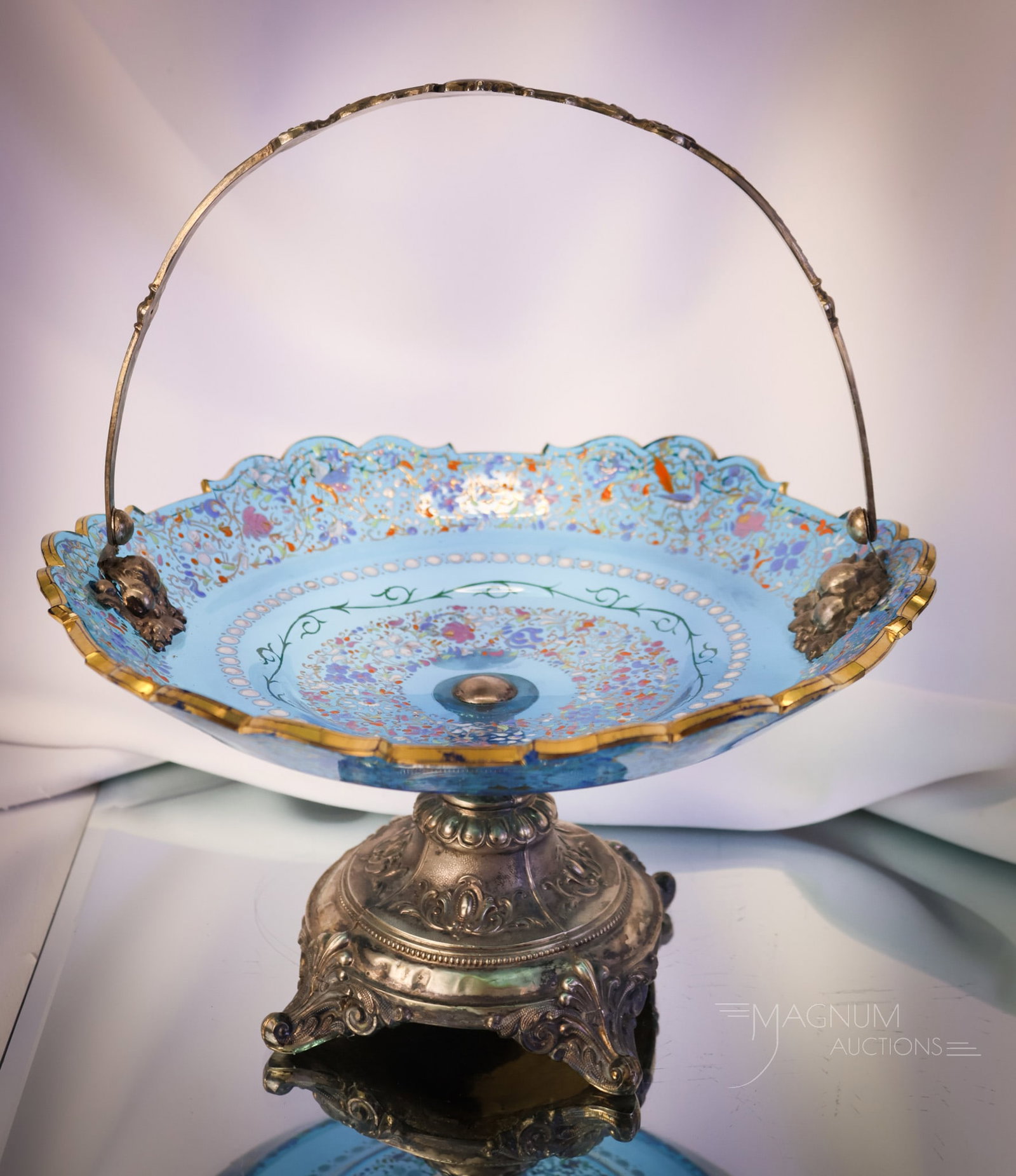 Moser Celeste Blue Victorian Enamel Glass Brides Bowl Victorian Silverplate Centerpiece: A lovely and eye-pleasing Victorian Celeste blue enameled glass brides' bowl centerpiece. This piece is attributed to Moser. This centerpiece comes with a silverplate holder. The complete piece measur