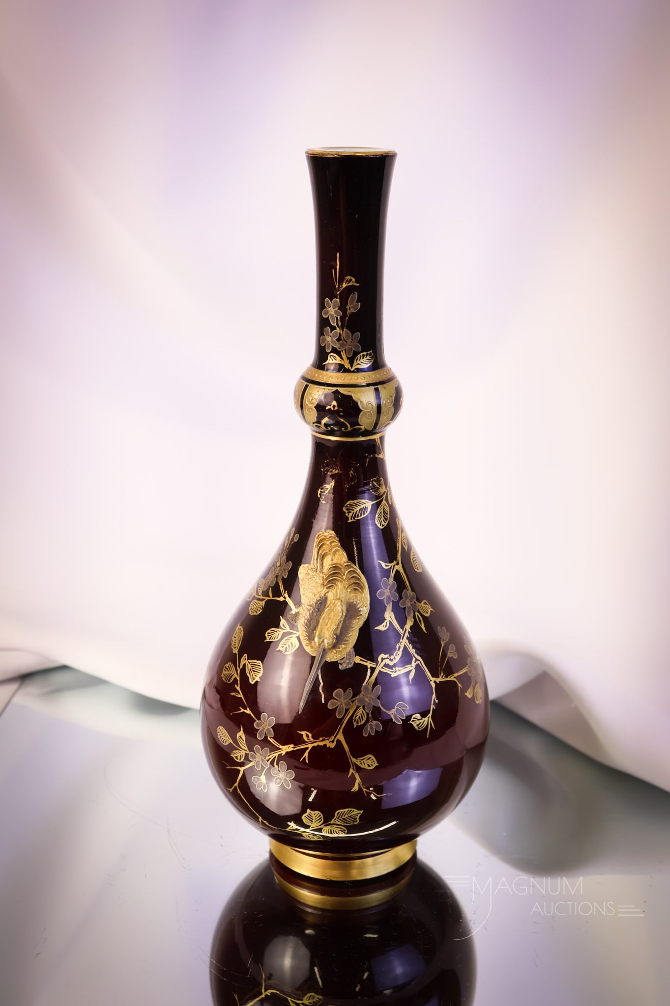 Harrach 10 1/2" Victorian Art Glass Gilt Enameled Kingfisher Vase: A superb find in Victorian art glass attributed to Harrach. This is an oxblood colored vase. It is cased glass. It is decorated with heavy, built-up decoration in gold enamel of a Kingfisher bird. Thi