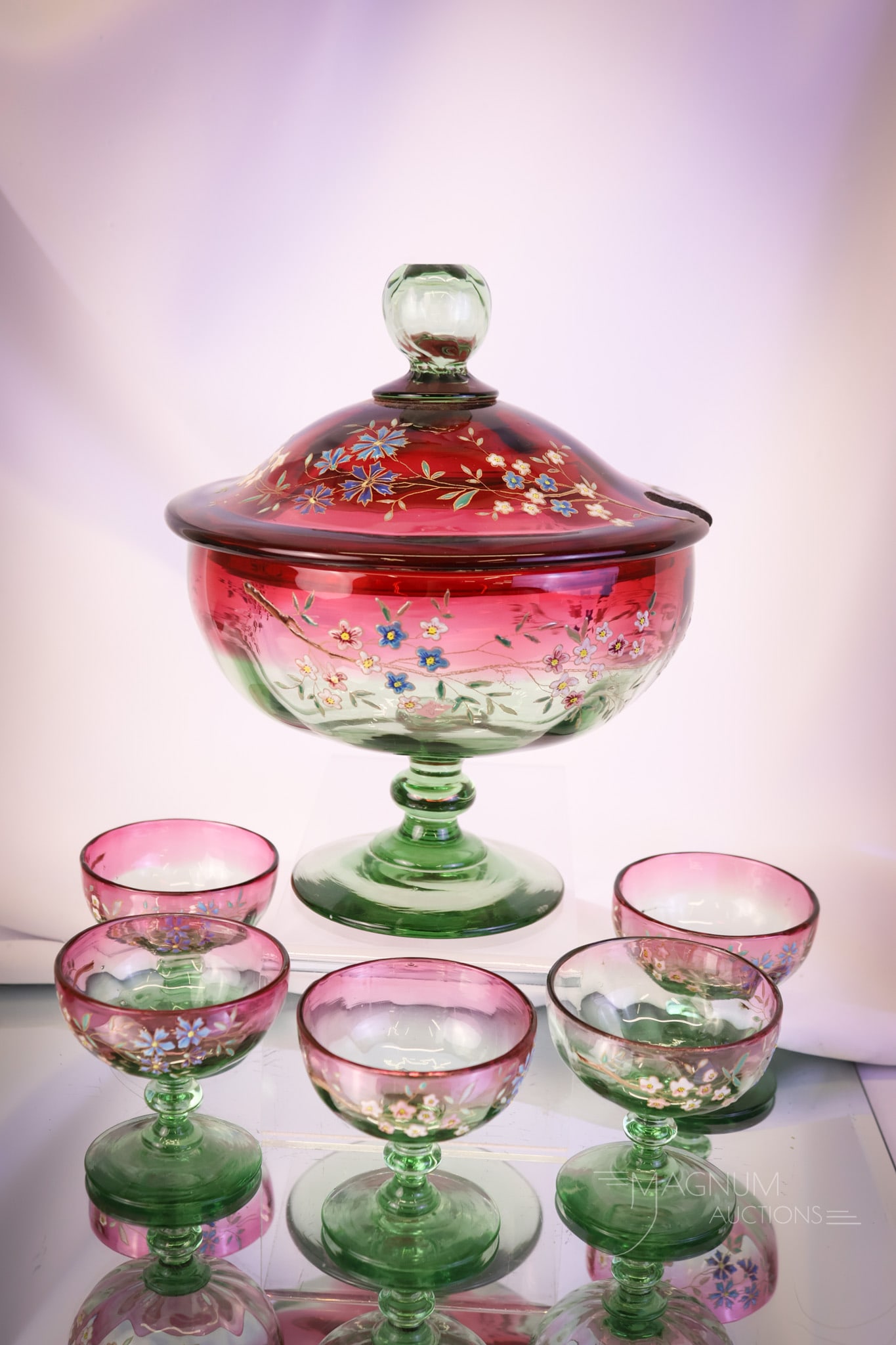 Victorian Greenarina Enamel Decorated Art Glass Diminutive Punch Custard Set: What a rare find this set is! This is a Victorian Greenarina (cranberry to green) art glass punch or custard set. This diminutive find includes the punch bowl with a slotted lid and five pedestal-form
