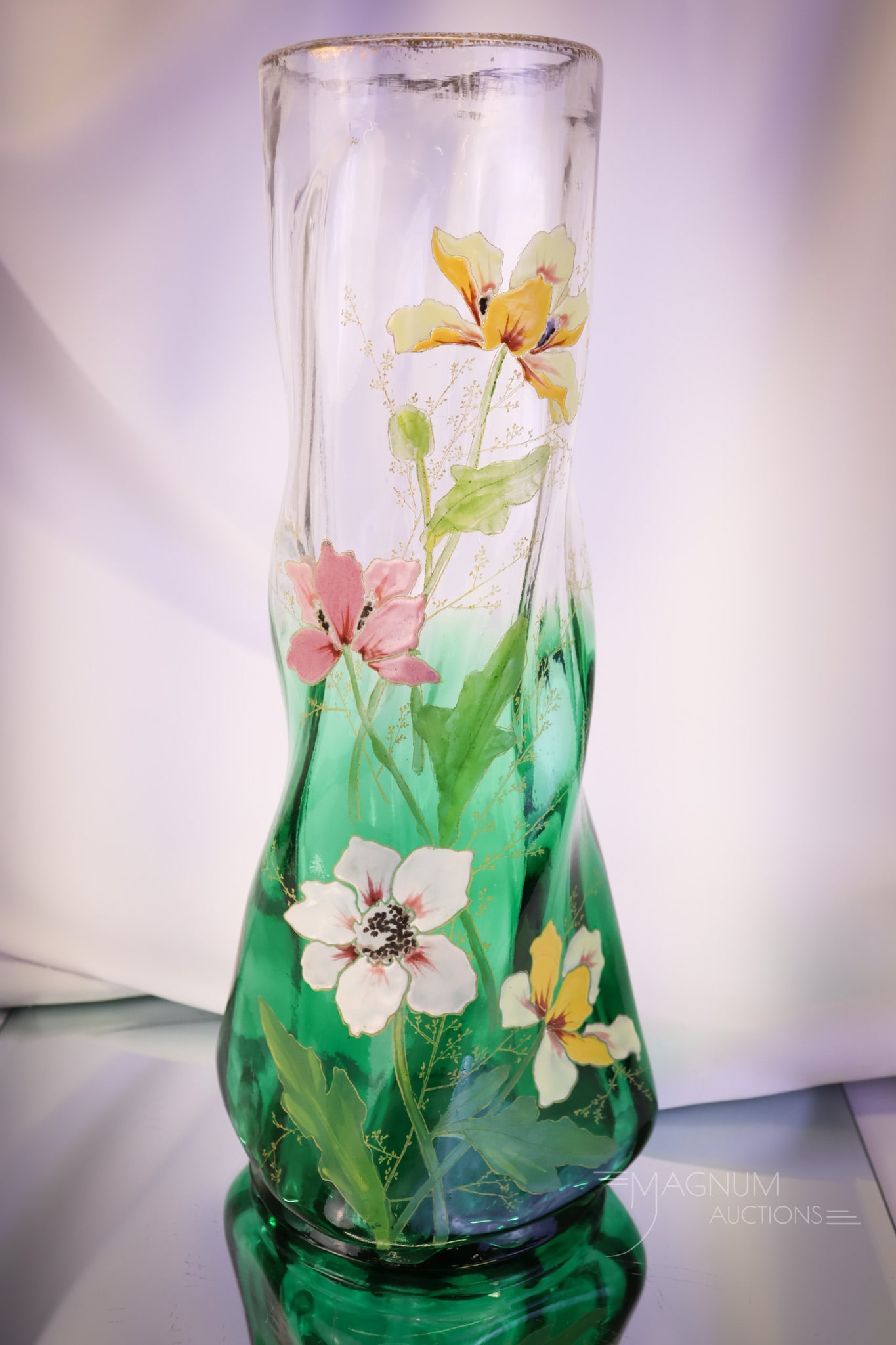 Legras Mt. Joye Enameled Art Glass 14" Vase: A beautiful and large find attributed to Legras or Mt. Joye. This is a twisted form of an art glass vase. It is decorated with heavy enameling of florals. The vase is in green ombre glass. The vase me