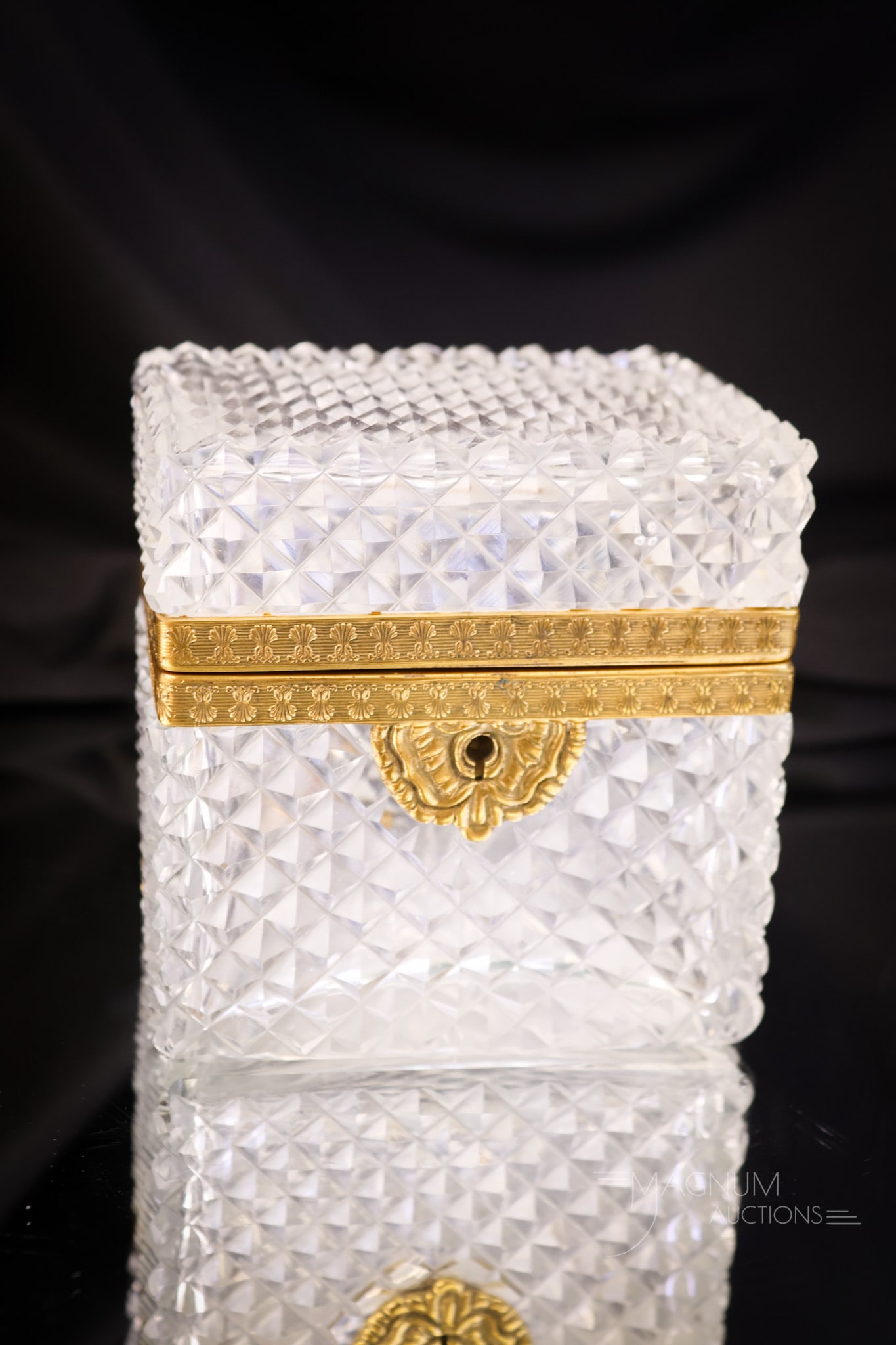 French Cut Crystal Jewelry Gilt Ormolu Mount Casket: A French, Regency-style cut crystal gilt ormolu jewelry casket. This piece retains the original key. A gorgeous find for your collection. The casket measures 4" tall and 3 3/4" wide. SHIPPING NOTICE: 